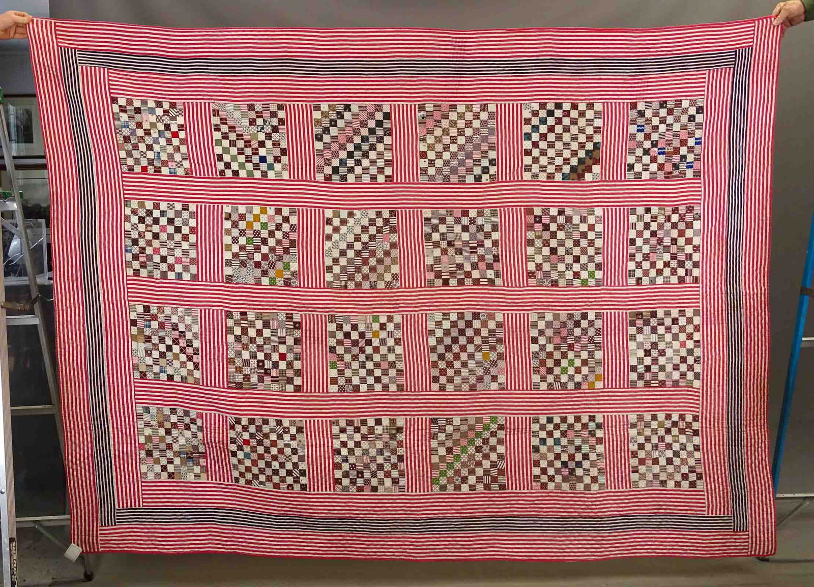 C. 1870 Postage Stamp Quilt: C. 1870 Postage Stamp quilt with red and white striped border. 75" x 88".
