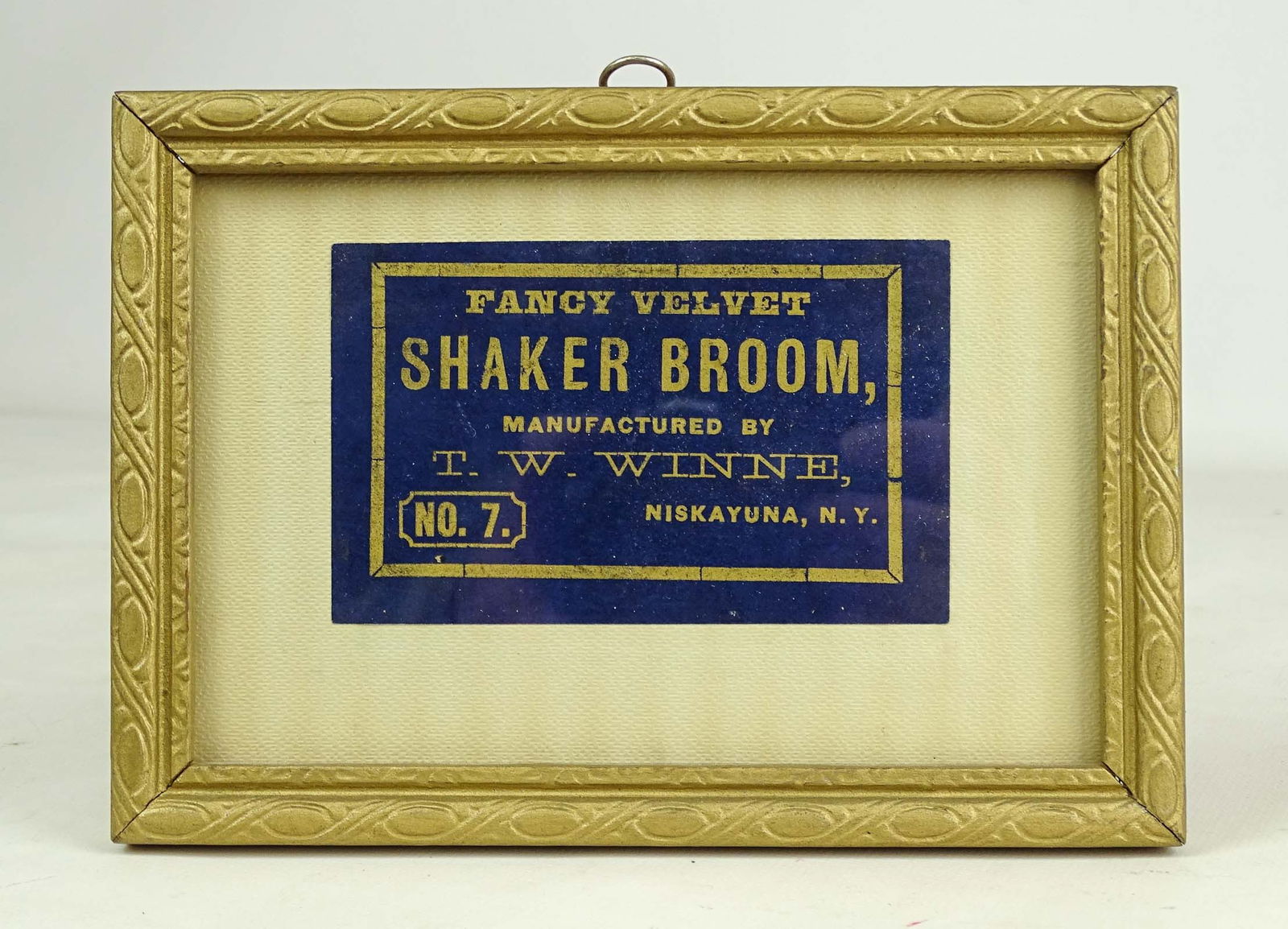 Shaker Broom Label: Framed Shaker Broom label "FANCY VELVET SHAKER BROOM, MANUFACTURED BY T.W. WINNE NO.7 NISKAYUNA, N.Y.". 5" x 7".
