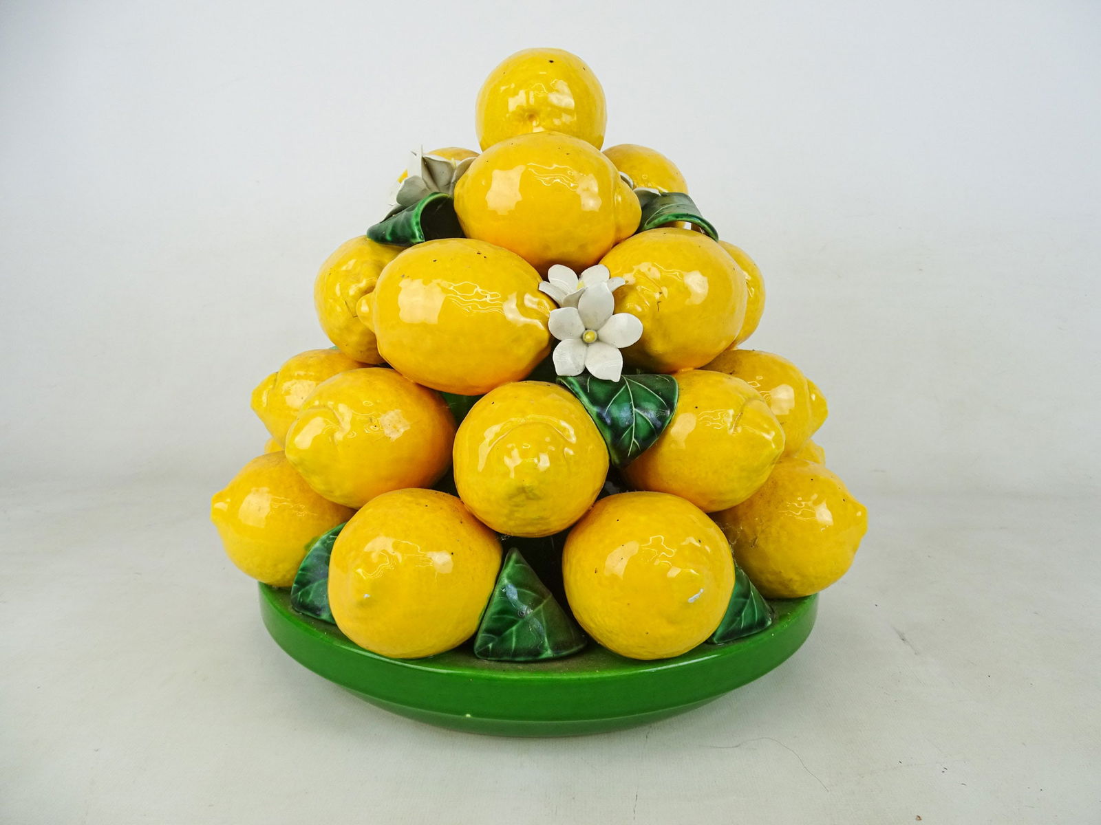 Ceramic Lemons Sculpture: Ceramic lemons sculpture. Approx. 12" D., 14" Ht..