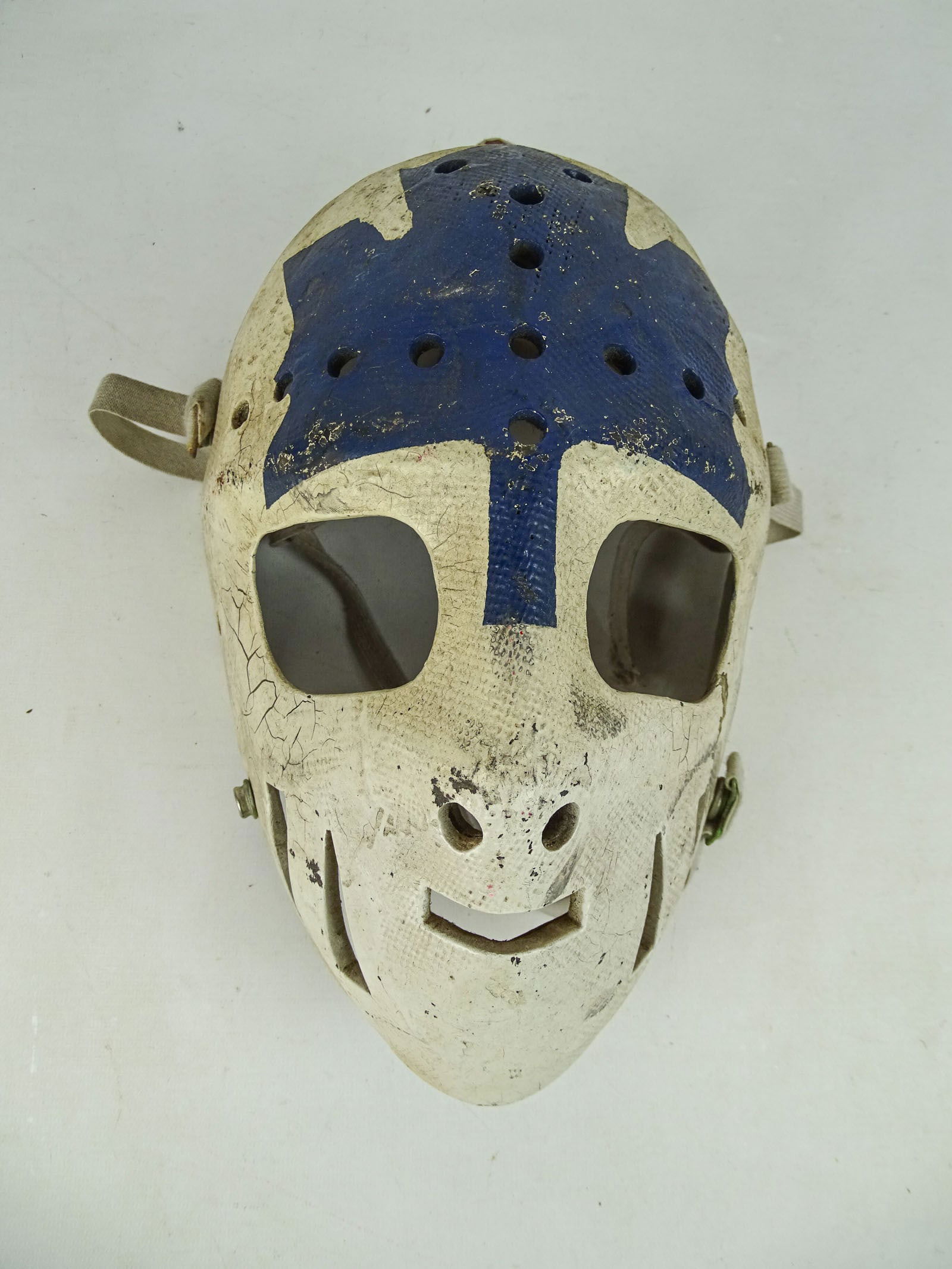 Hockey Mask Sculpture: Hockey mask sculpture. C. 1970's attributed to Ernie Higgins. 11" x 8" x 5".