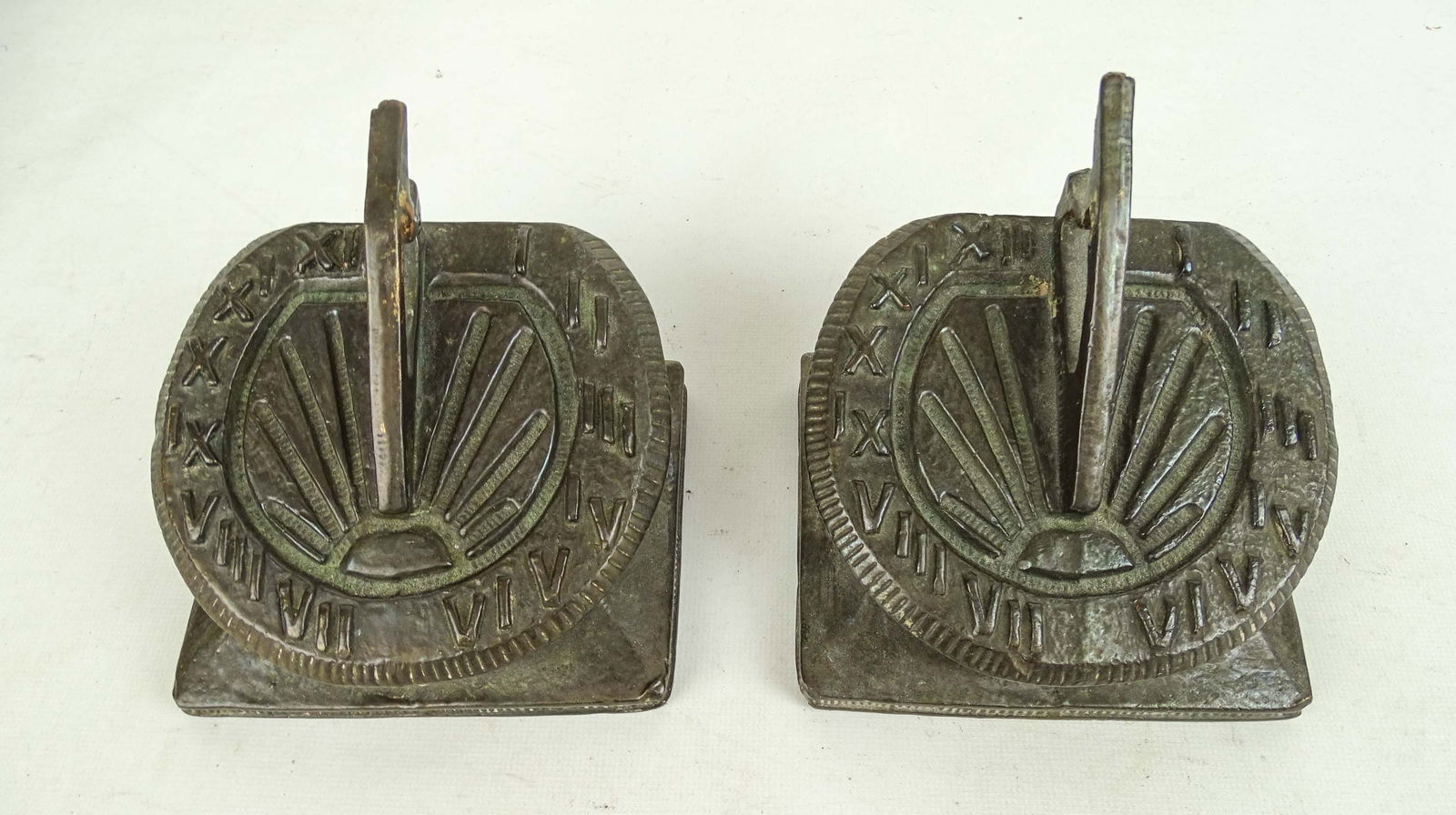 Pair Sundial Bookends: Pair of "Pompeian" bronze sundial bookends. 5" x 5" x 4 1/2" Ht..
