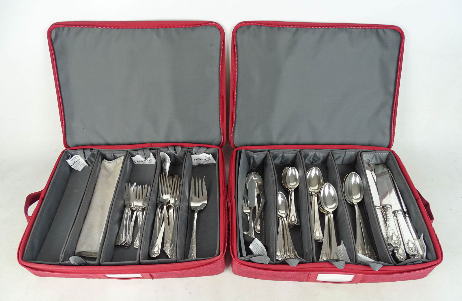 Silverplate Flatware: Rogers Brothers silverplate "Heraldic" pattery flatware. (3) 8" serving spoons, (12) 7" spoons, (12) 6" spoons, (12) 9 1/2" knives, (11) 7 1/2" forks, (11) 6" forks, (5) misc. serving pieces.