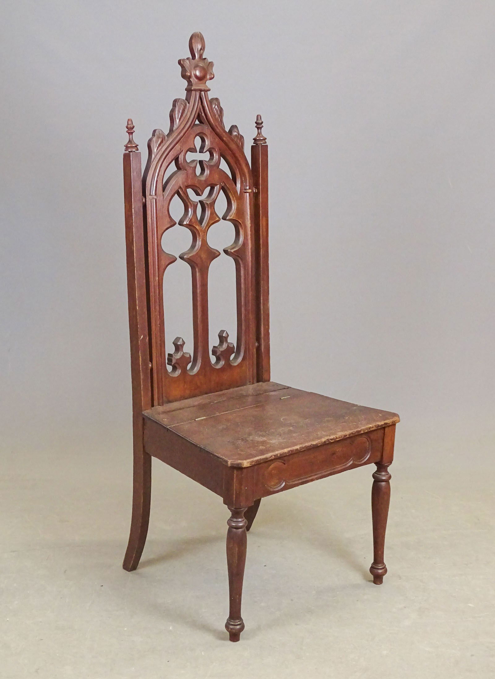 19th c. Gothic Chair: 19th c. carved Gothic chair. Seat has lift lid with compartment. 17" seat Ht., 51 3/4" overall Ht..