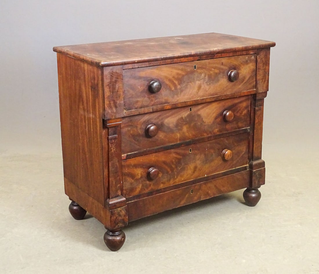 19th c. Empire Three Drawer Chest: 19th c. Empire mahogany three drawer chest with bun feet. 37" x 18 1/2" x 33" Ht..