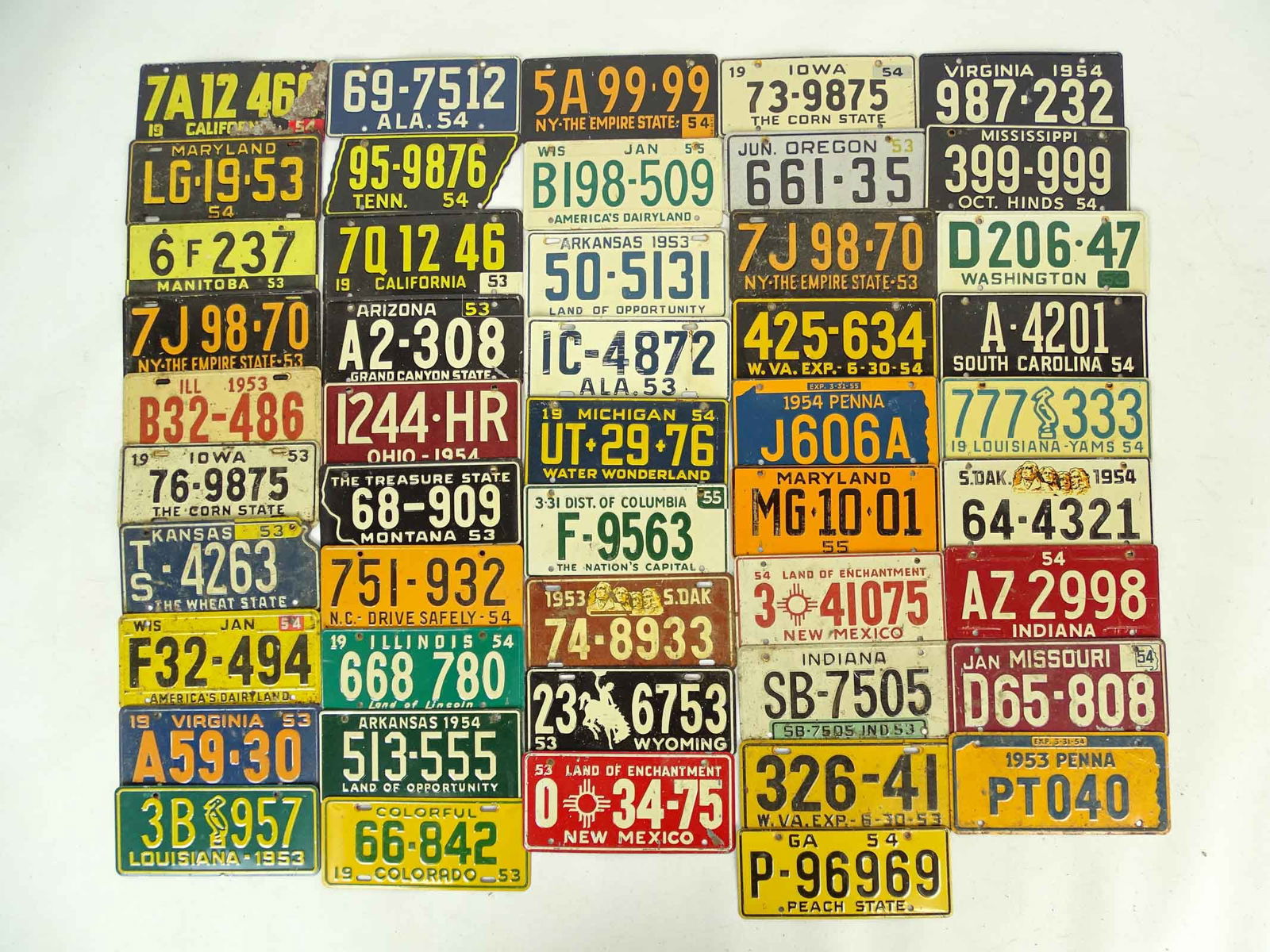 Collection of Vintage Bicycle License Plates: Collection of vintage bicycle license plates. Various States, C. 1950's, 2 1/2" x 5". Approx. 100.