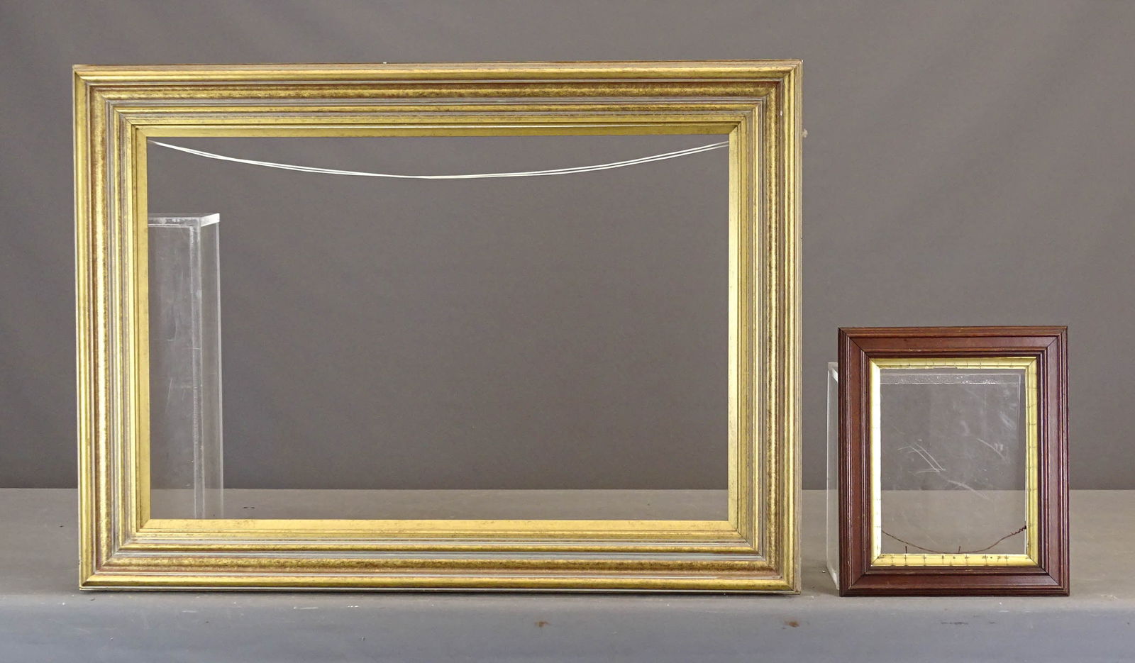 Frame: Contemporary frame. Rabbet size 30" x 20", overall 37" x 26", along with Victorian frame (rabbet size 9 1/2" x 7 1/2", overall 13 1/2" x 11 1/2").