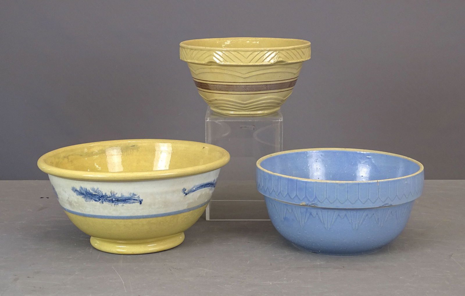 Yelloware Kitchen Bows: Lot (2) yelloware kitchen bowls (one seaweed decorated, 9" x 12" D.), and blue bowl (10" D.).