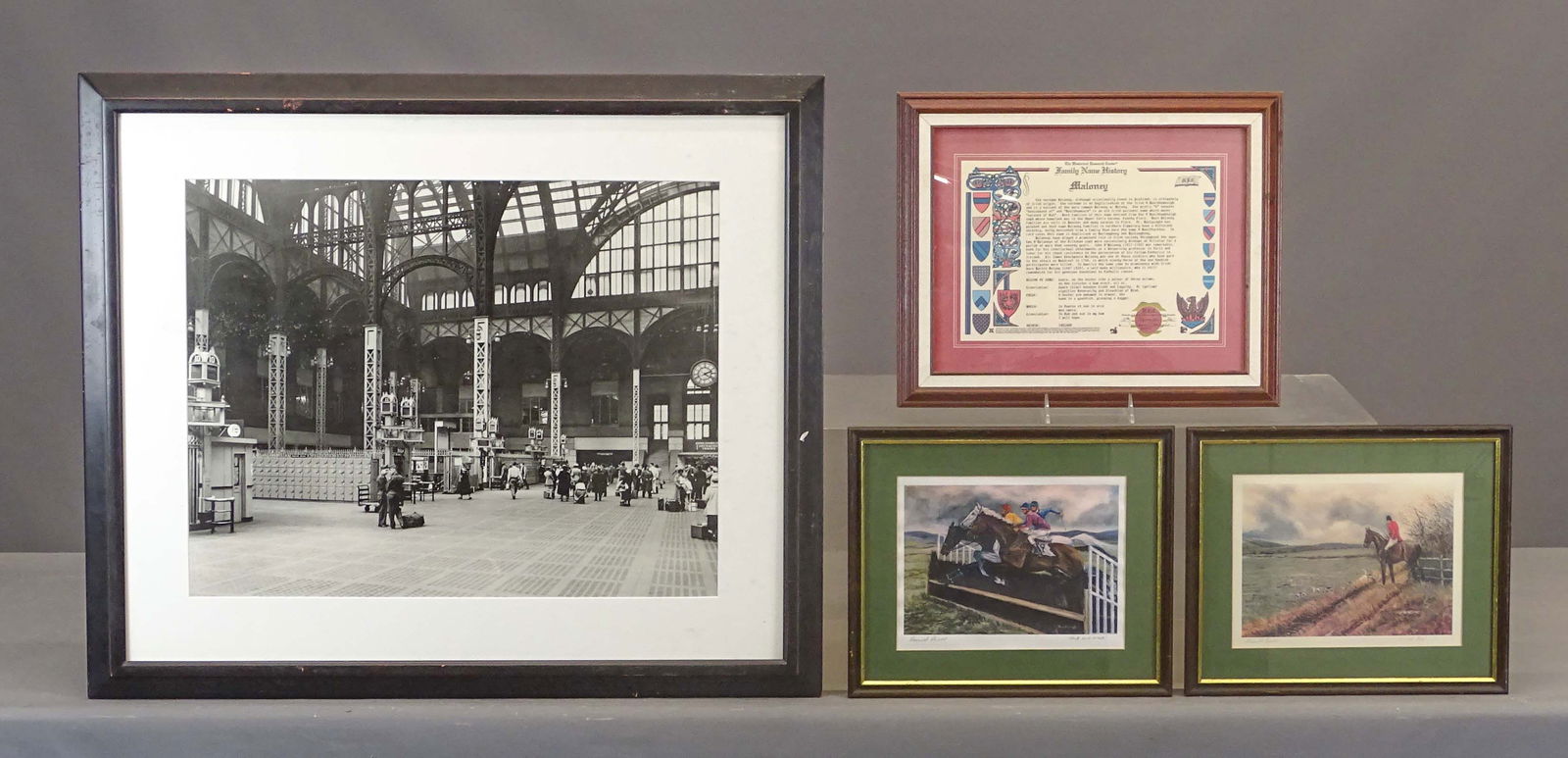 Artwork Lot: Artwork lot including: (2) pencil signed horse prints "…Ausel" (overall 12" x 14"), photo print of Penn Station (overall in frame 27" x 32"), Family Name History print "Maloney" (overall 14" x 17").