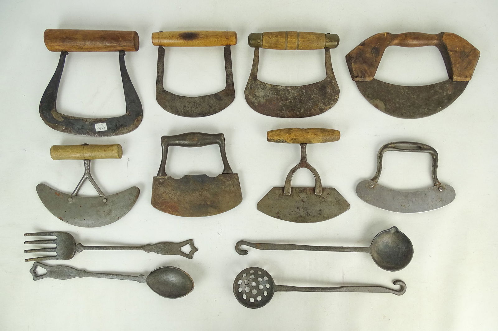 Antique Metalware Lot: Antique metalware including (8) choppers (largest 8" L.), (4) iron utensils (longest 12" L.).