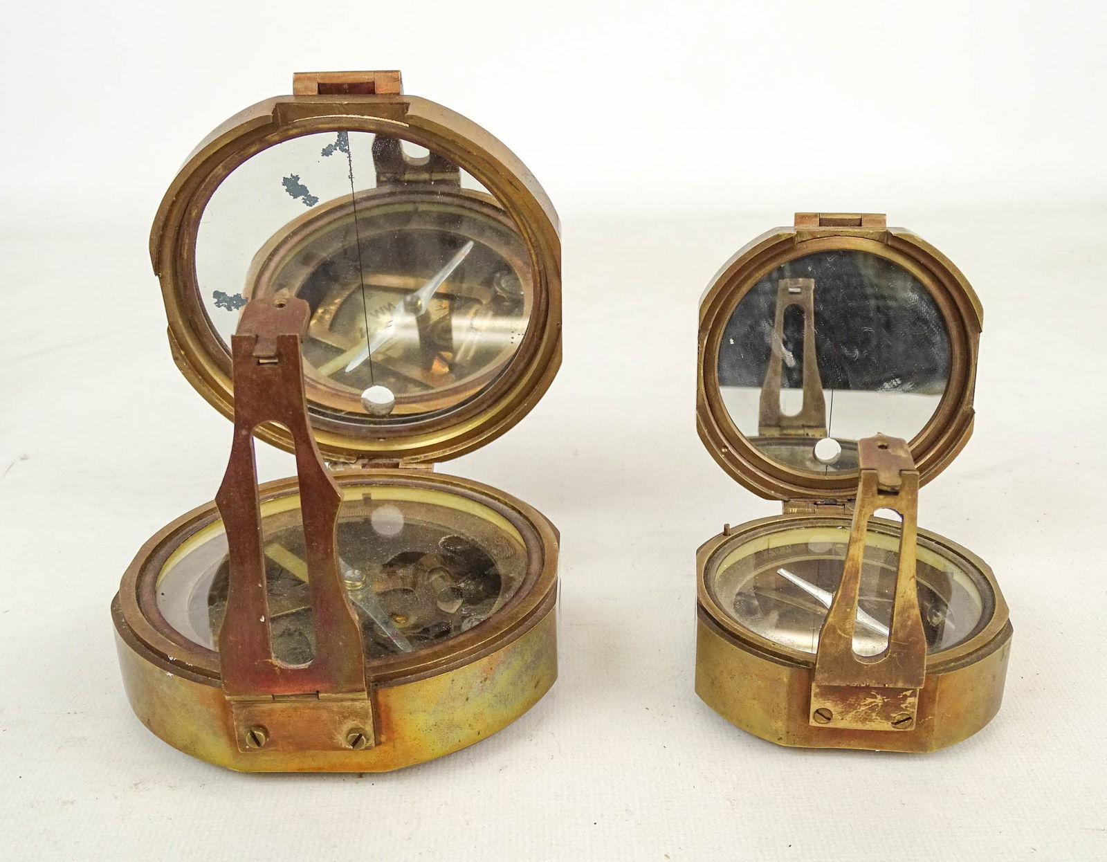 Antique Compass Lot: Lot (2) antique brass compasses. Both marked Stanley London (3 1/4" x 3" and 4 1/4" x 4 1/2").
