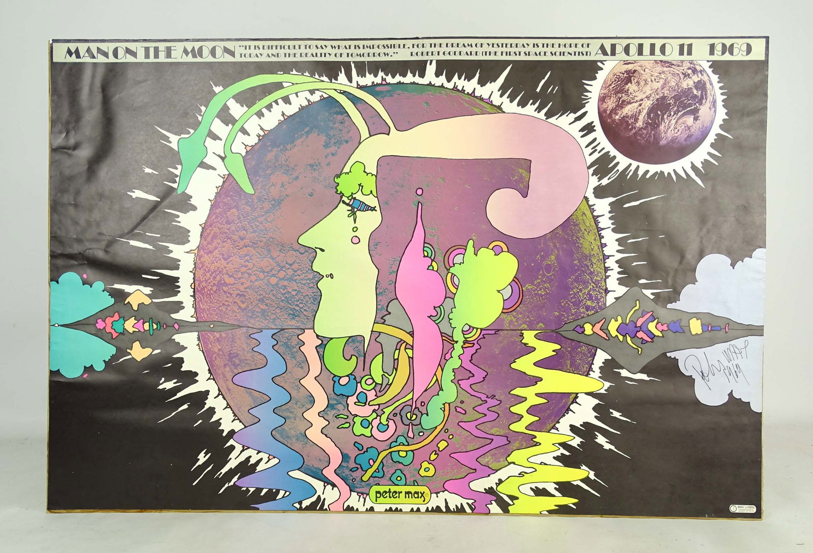 Peter Max Poster: Peter Max poster-Man on the Moon Apollo II 1969. Signed and dated 1969. Adhered to panel backing. 24" x 36".
