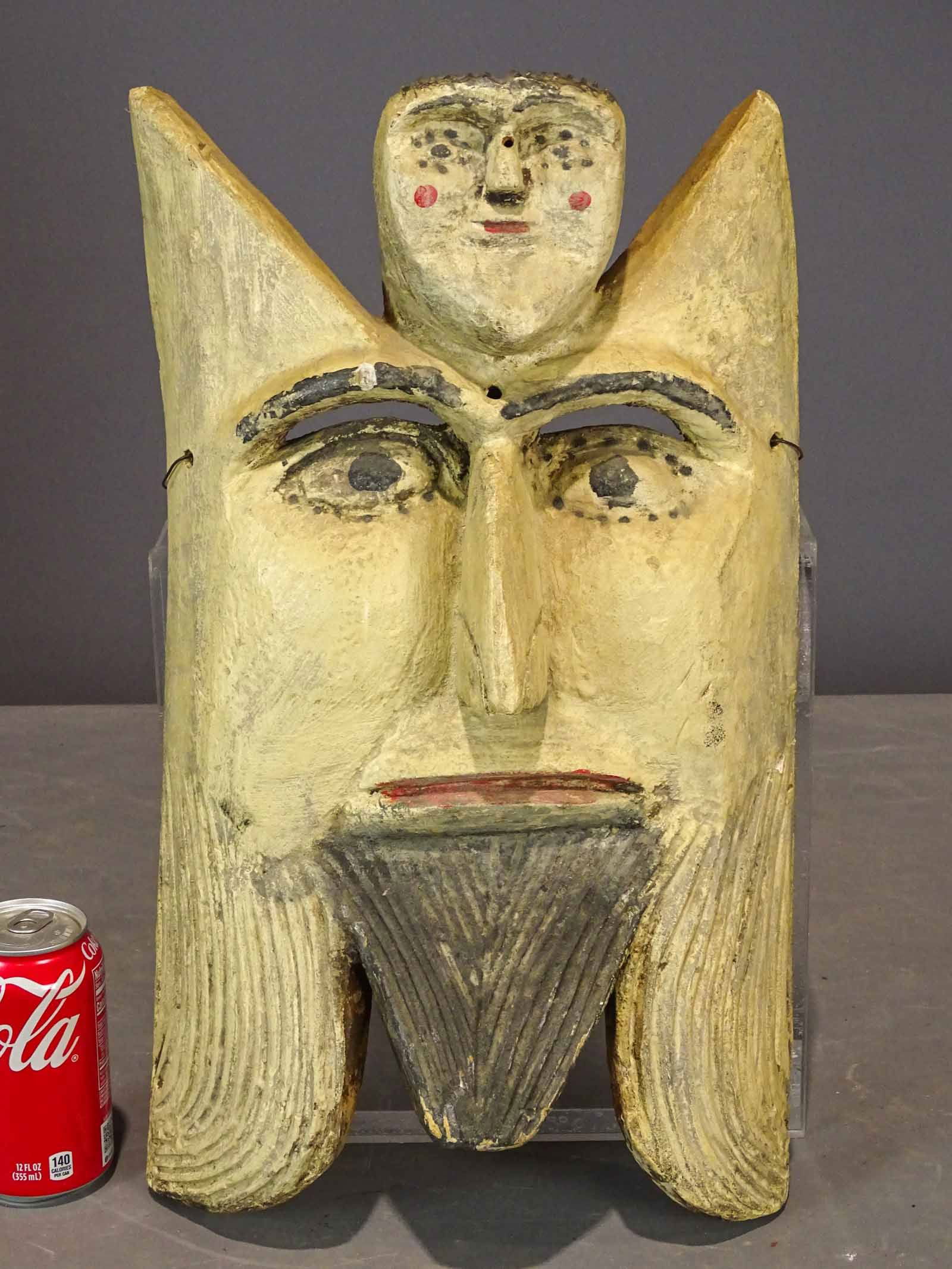 Folk Art Carved Mask: Folk art carved wooden mask. 19" x 11".