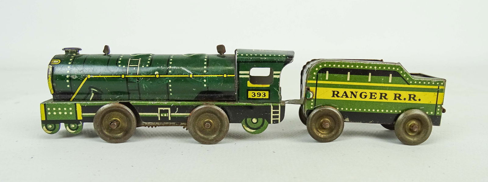 Miniature Tin Trains: Two miniature tin litho trains. 3" and 2" L..