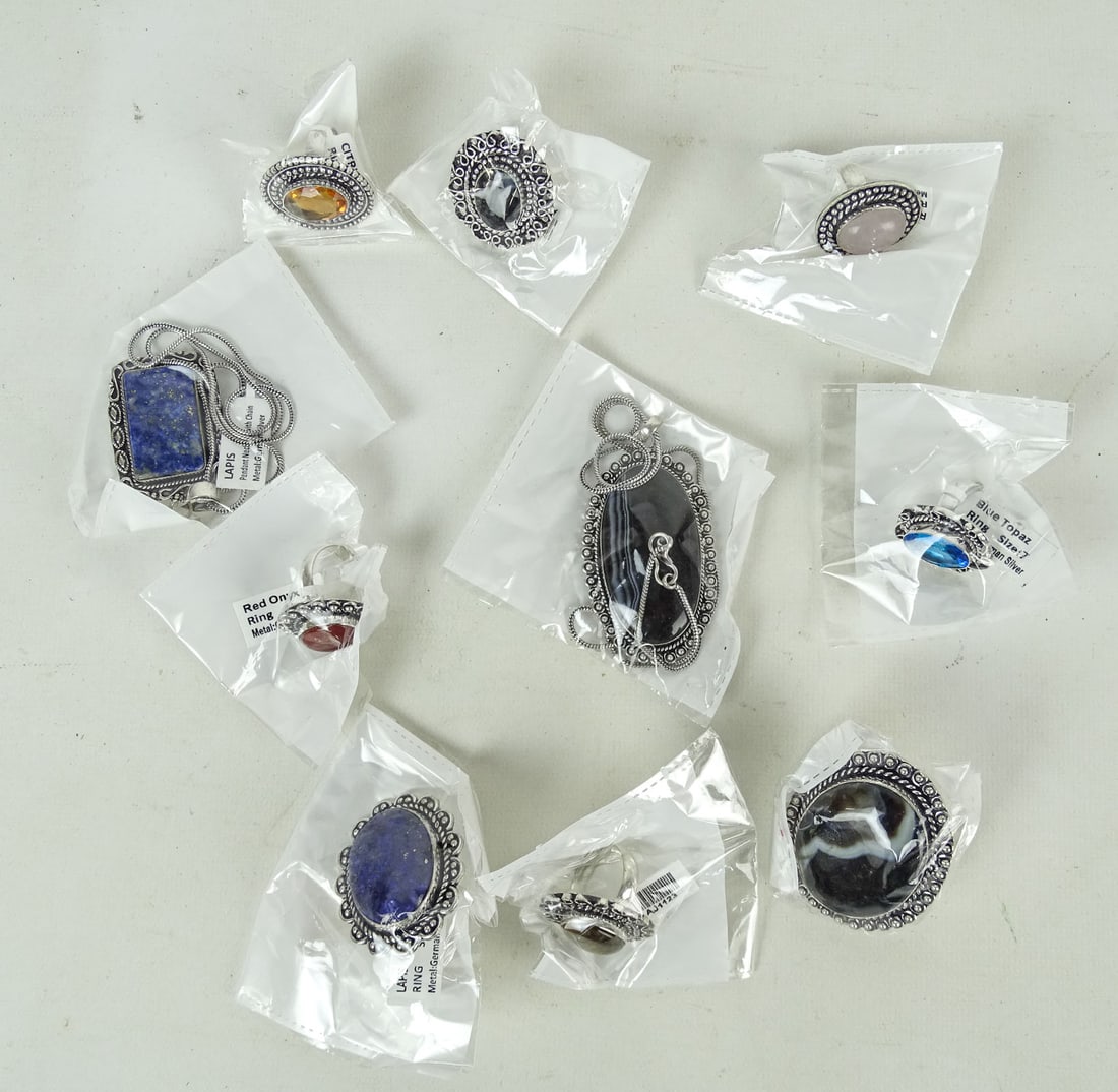 Assorted Jewelry Lot: Lot (10) pieces of assorted jewelry including rings, necklace and brooch. Includes Onyx, Lapis, Blue Topaz etc..