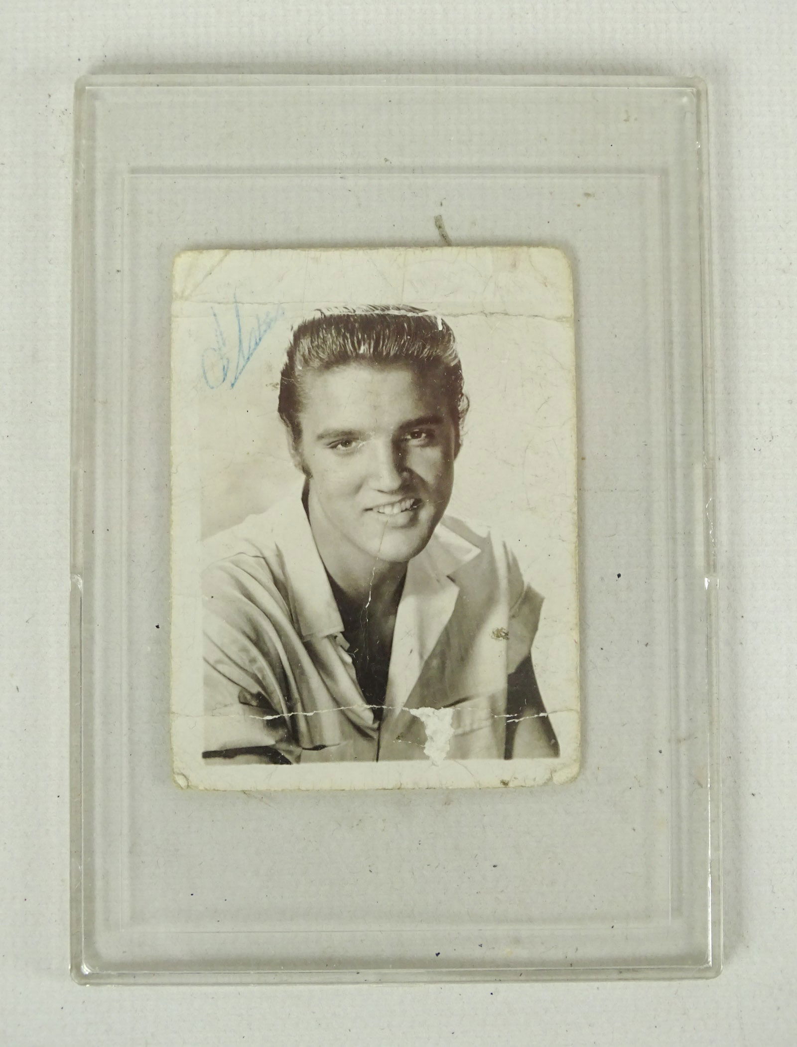 Elvis Presley Autographed Snapshot: Elvis Presley snap shot with autograph (as is). 2 1/2" x 1 3/4".