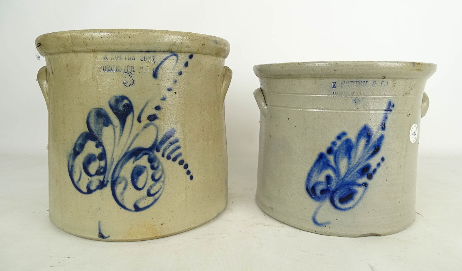 Norton Stoneware Lot: Norton Stoneware Lot: "B Norton Sons Worcester Mass" (3 gal crock with decoration, 10" Ht), "E. Norton & Co. Bennington VT" (2 gal crock, 8 3/4" Ht).