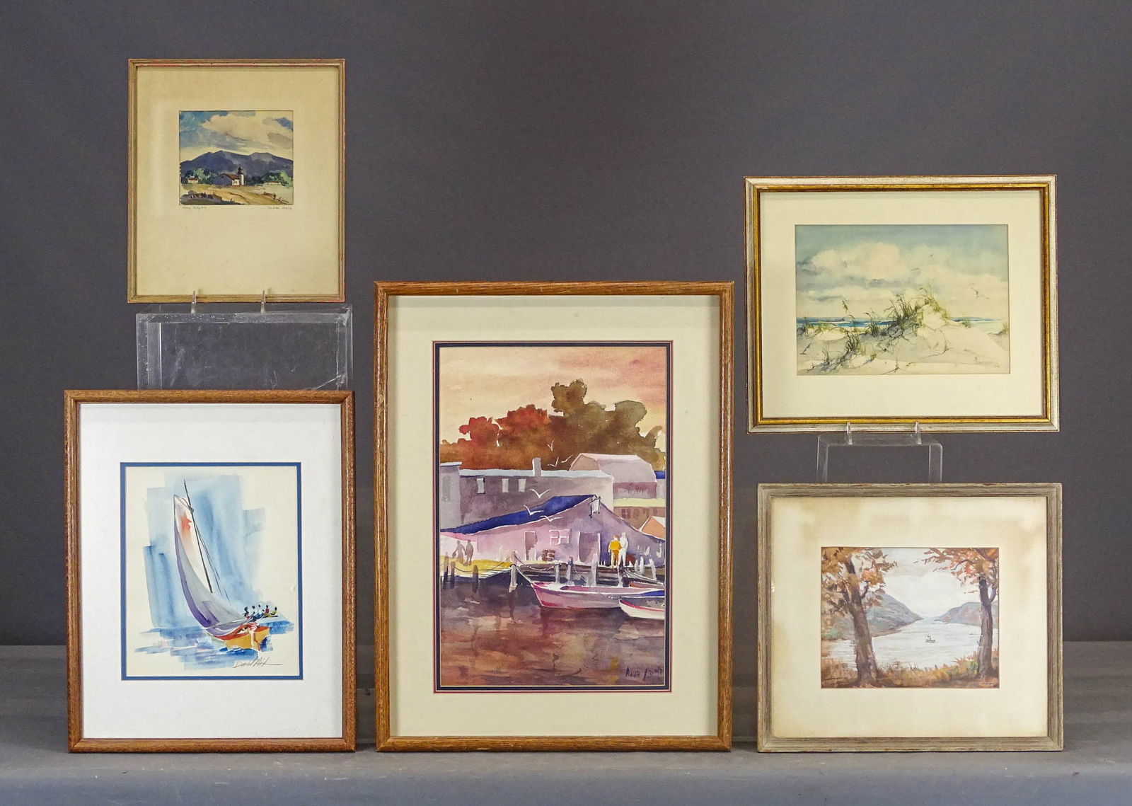 Artwork Lot: Artwork lot including: Riverscape, pastel (overall 14" x 16"), watercolor, sail boat (pencil signed, overall 19" x 15"), harborscape (signed LRC, overall 25" x 19"), beach scene signed "Tenhundfeld"