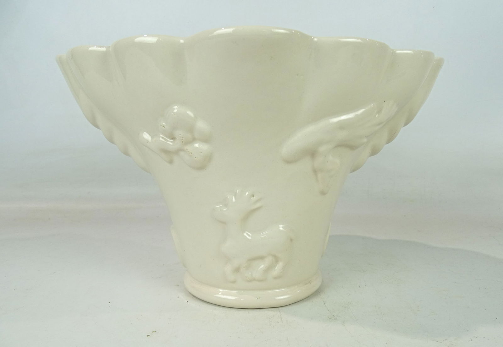 Chinese Ceramic Libation Cup: White blanc de Chine Dehua porcelain antique libation cup. Various raised animal and naturalistic figures. China, Asian pottery. 13" x 10" x 8".