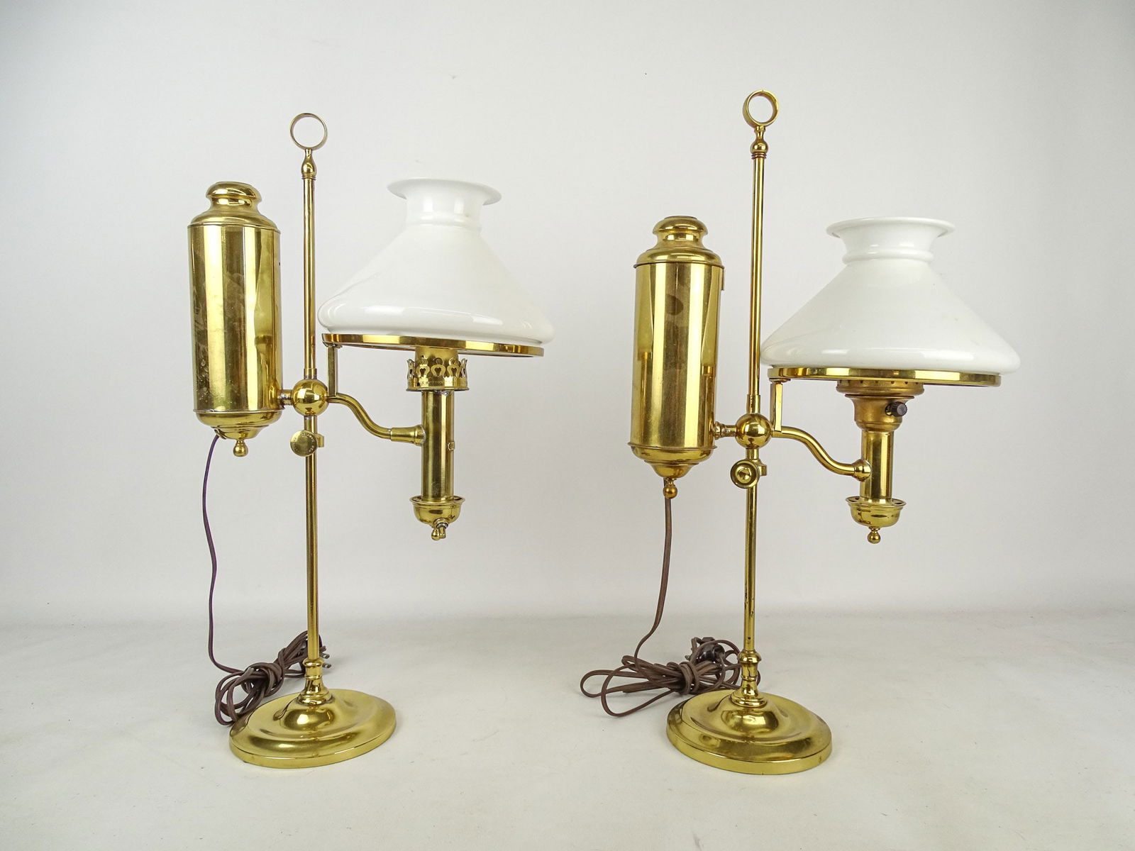 Student Lamps: Pair of brass electrified student lamps. 21" Ht. one shade chipped.