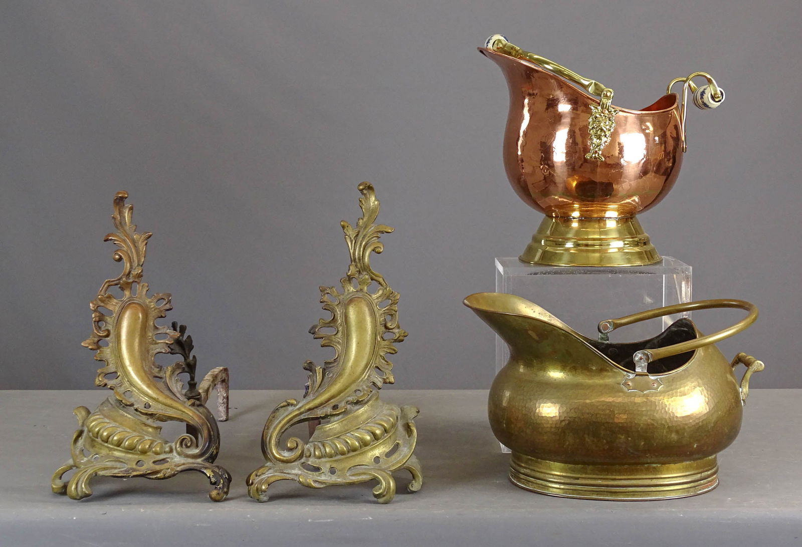 Andiron Lot: Lot including: Pair of fancy brass andirons (17" Ht., 19" L.), copper coal bucket (14" x 12" x 14"), the other 16" x 11" x 11".