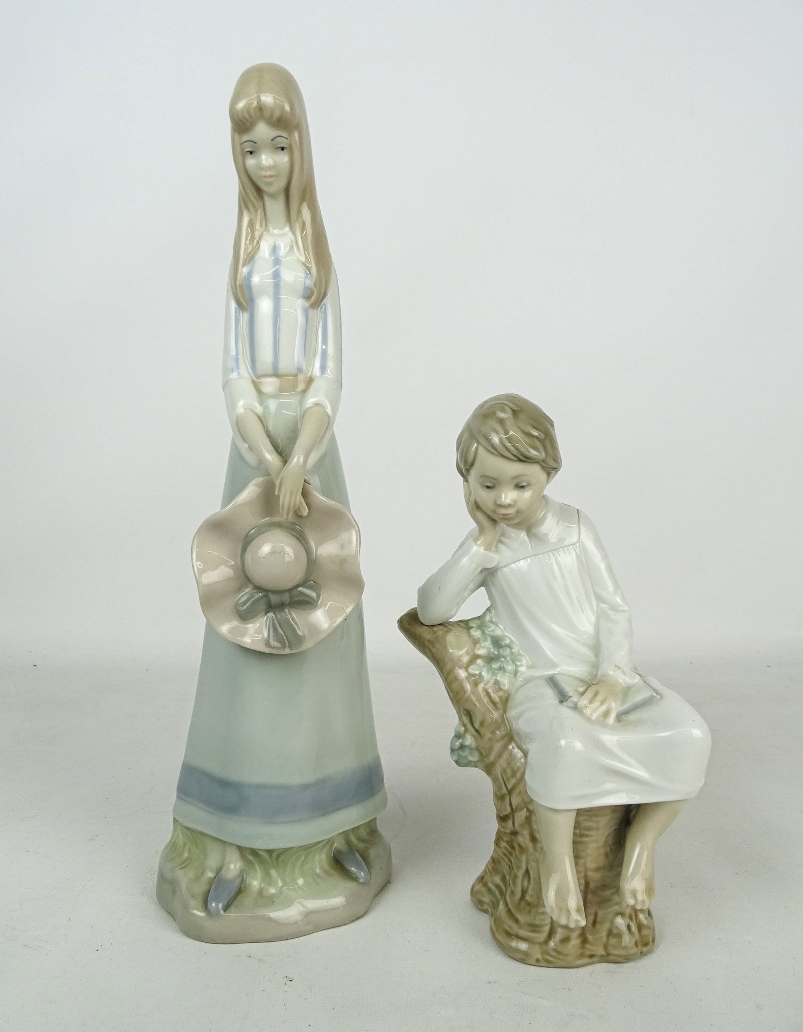 Lladro Lot: Lot including: Lladro figurine of child reading (8 1/2" Ht.), Levante figurine (made in Spain, 13" Ht.).