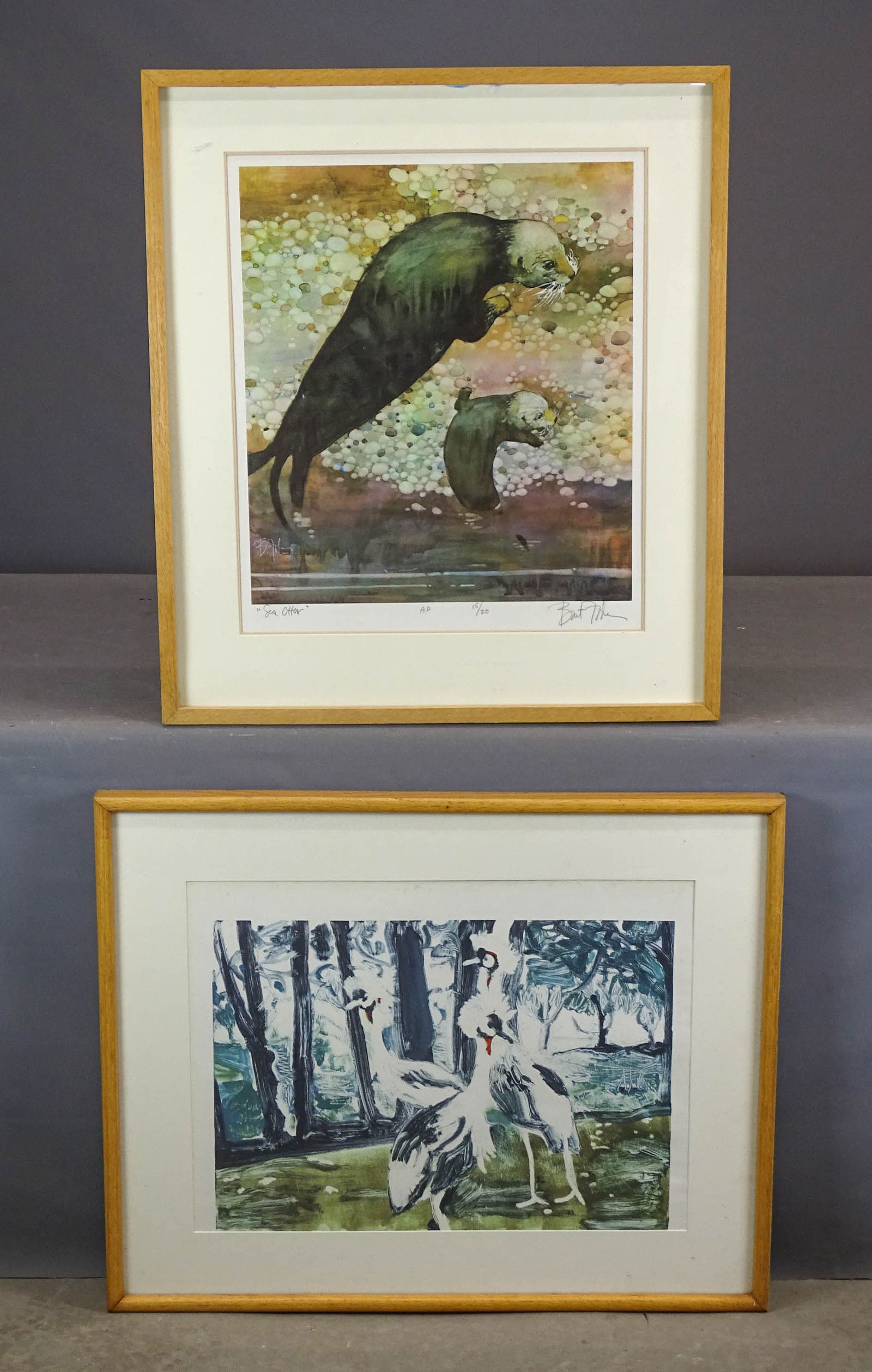 Artwork Lot: Artwork lot including: Lithograph of animals in landscape (overall in frame 25 1/2" x 32"), and pencil signed Otter print (31" x 26").