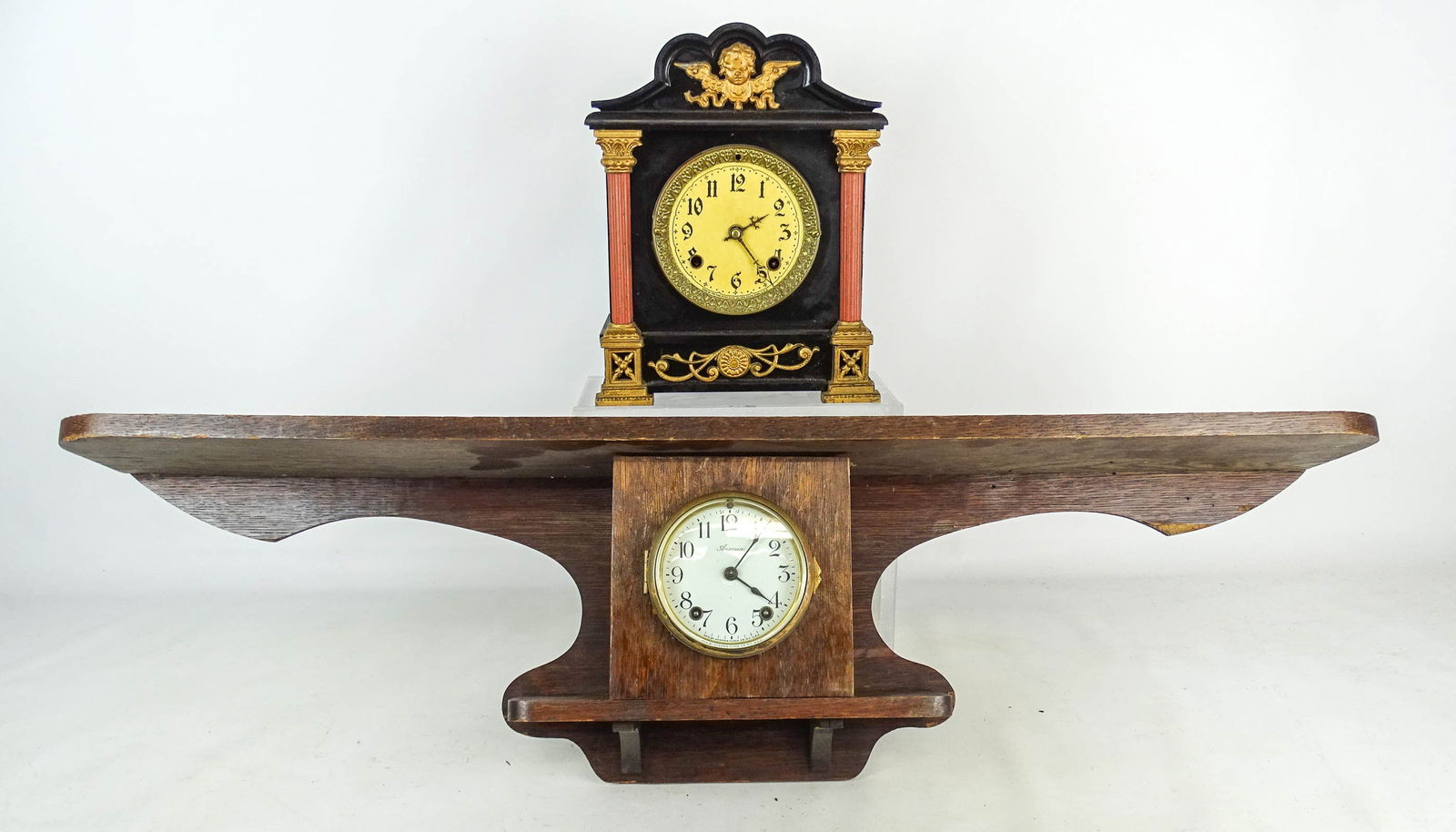 Clock Lot: Clock lot including: Ansonia Arts and Crafts oak (39" x 6" x 9" Ht.), and Victorian slate mantel (New Haven Clock Co.), as is, 9" x 6" x 12".
