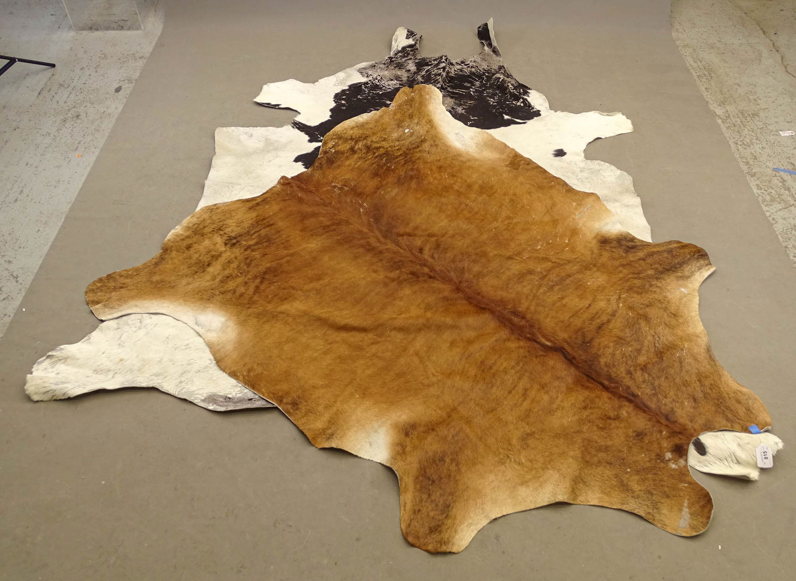 Lot (2) Cowhides: Lot (2) Cowhides (approx. 75" x 84" and 7' x 9', as is).
