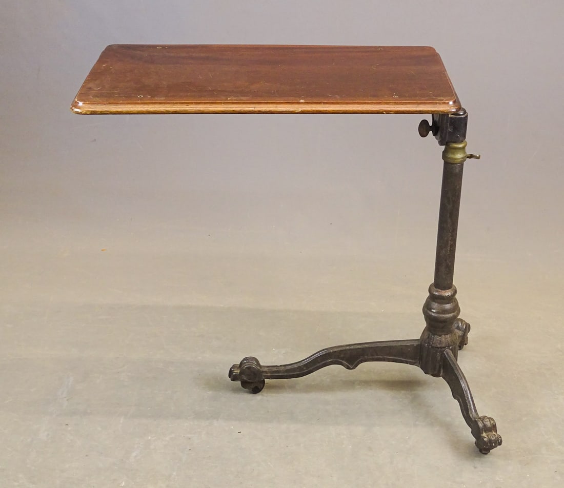 Cast Iron Base Folding Table: C. 1900 cast iron base folding table. Approx. 31" W., 34" Ht..