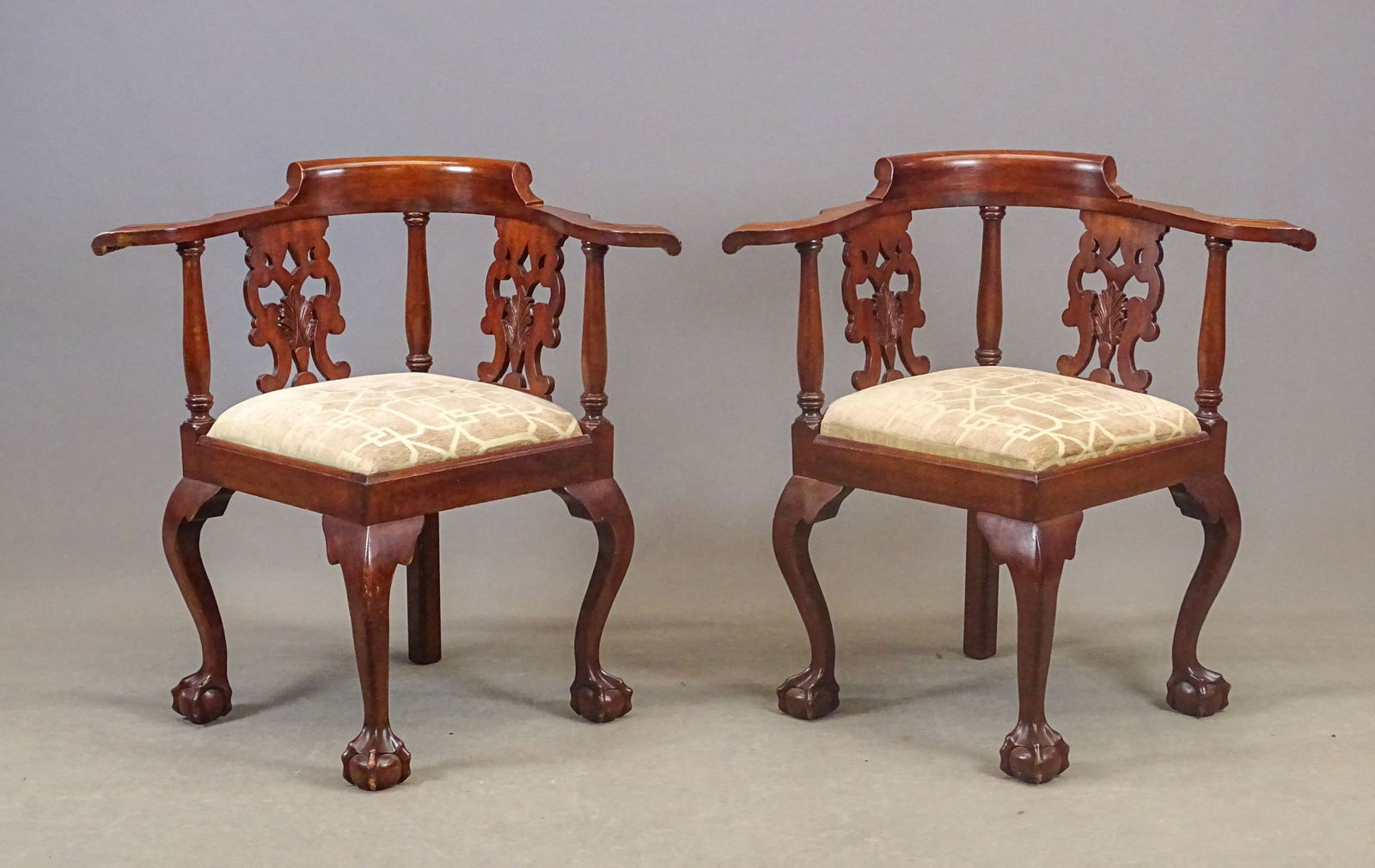Pair of Carved Mahogany Corner Chairs: Pair of vintage carved mahogany Chippendale style corner chairs. 25" x 18" x 33" Ht..