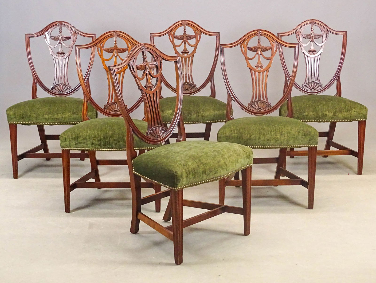 Set of Hepplewhite Style Dining Chairs: Set of (6) carved mahogany Hepplewhite style dining chairs. 18" seat Ht., 39" overall Ht..