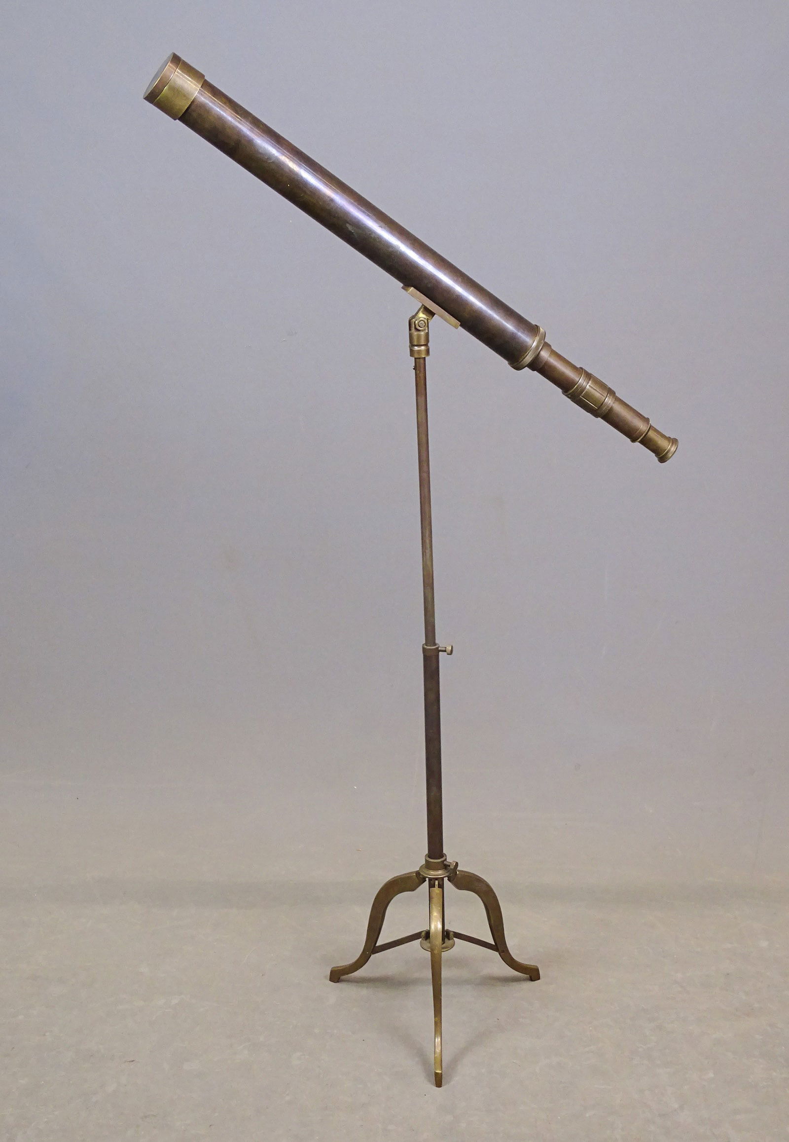 Brass Telescope: Brass floor telescope. Adjustable. Telescope 28" L., 42" Ht..