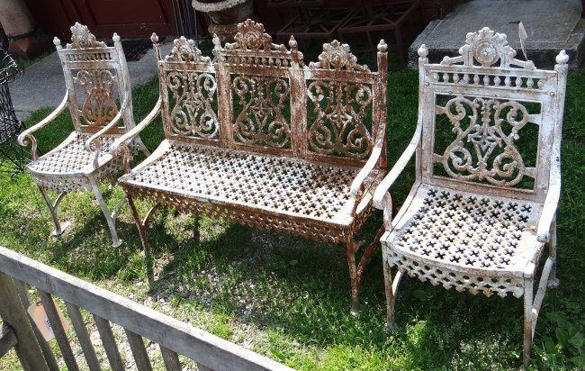 Cast Iron Garden Set: Cast iron (3) piece garden set including settee 44" W x 15 1/2"Ht. seat, 36" Ht. overall and a pair of arm chairs.