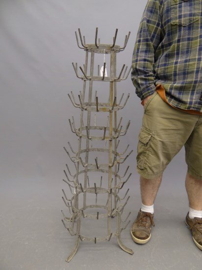 Display Rack: Decorative metal display rack. 43" Ht. Provenance Myron Goldfinger Collection.