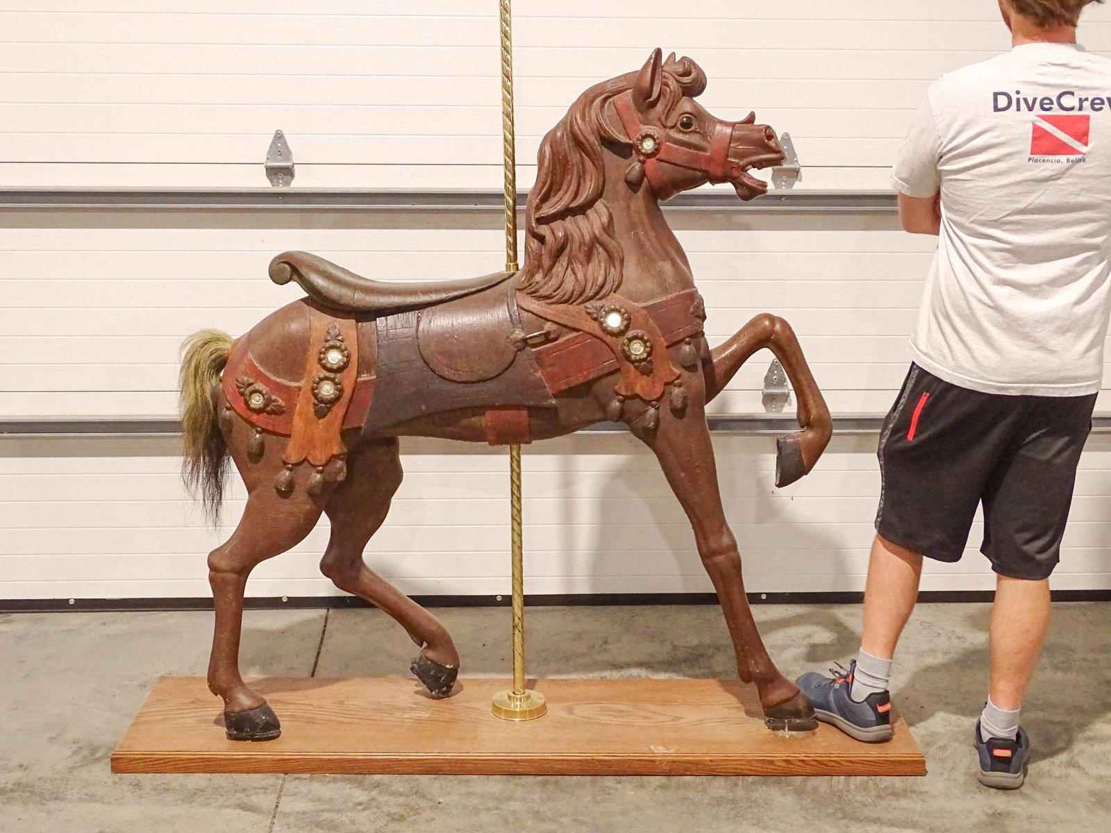 Antique Carousel Horse: Impressive carved wooden Carousel horse. 53" x 10" x 62" Ht.. On custom base with brass pole.