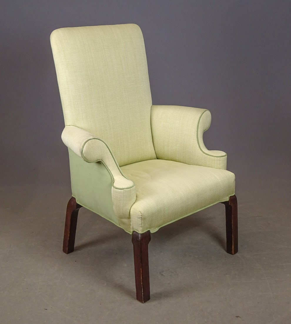 English Wing Chair: English upholstered wing chair with mahogany base. 18" seat Ht., 43" overall
