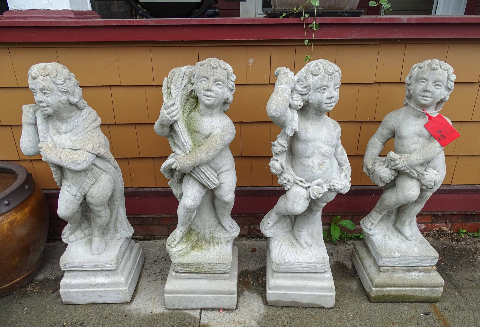 Set (4) Poured Stone Figures: Set (4) poured stone figures on bases. 39" Ht..