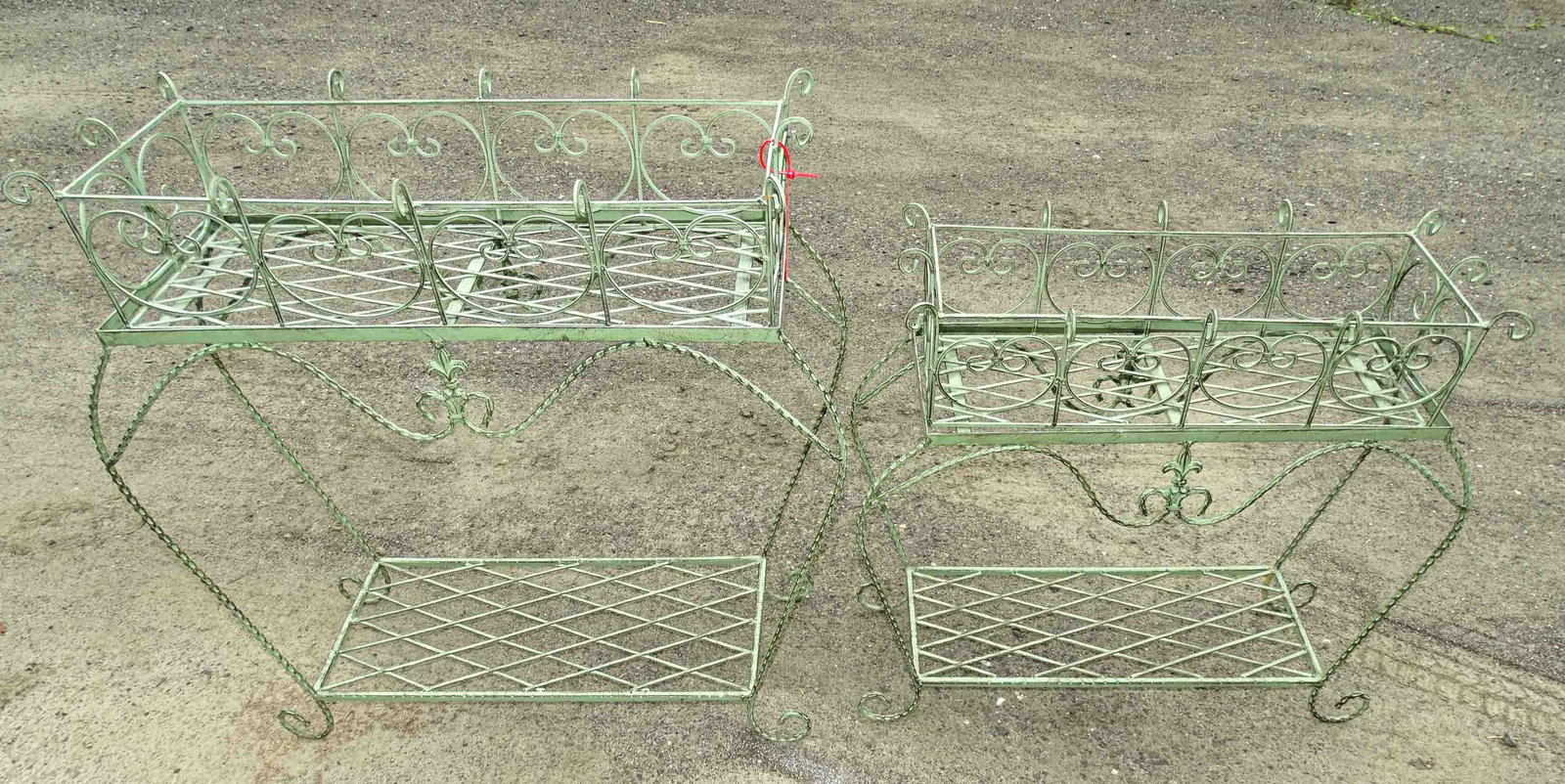 Plant Stands: Two wrought iron plant stands in verdigris patina. 25" and 32" L..