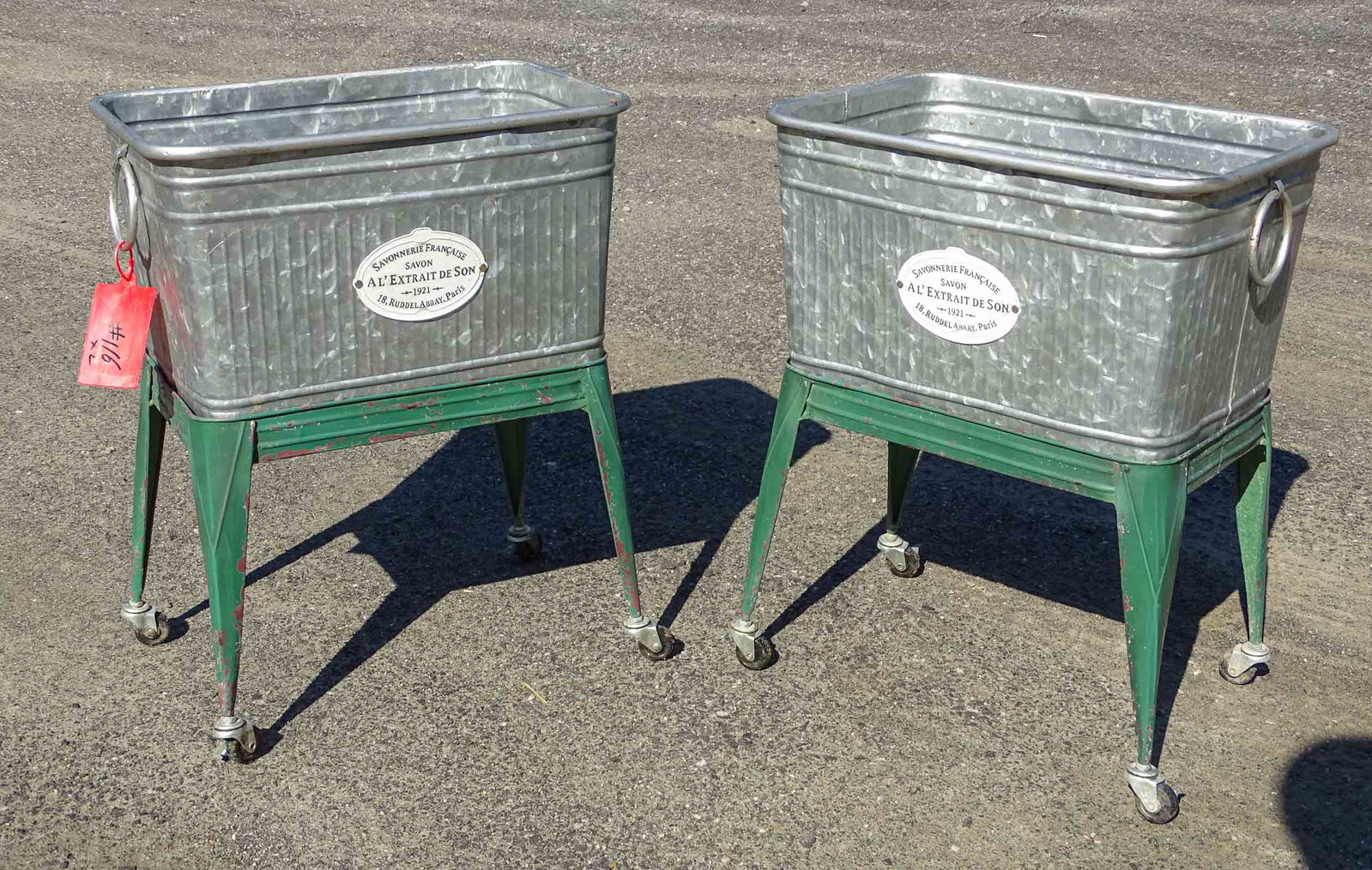 Pair French Style Planters: Pair French style metal rolling planters. 20" x 14" x 25".