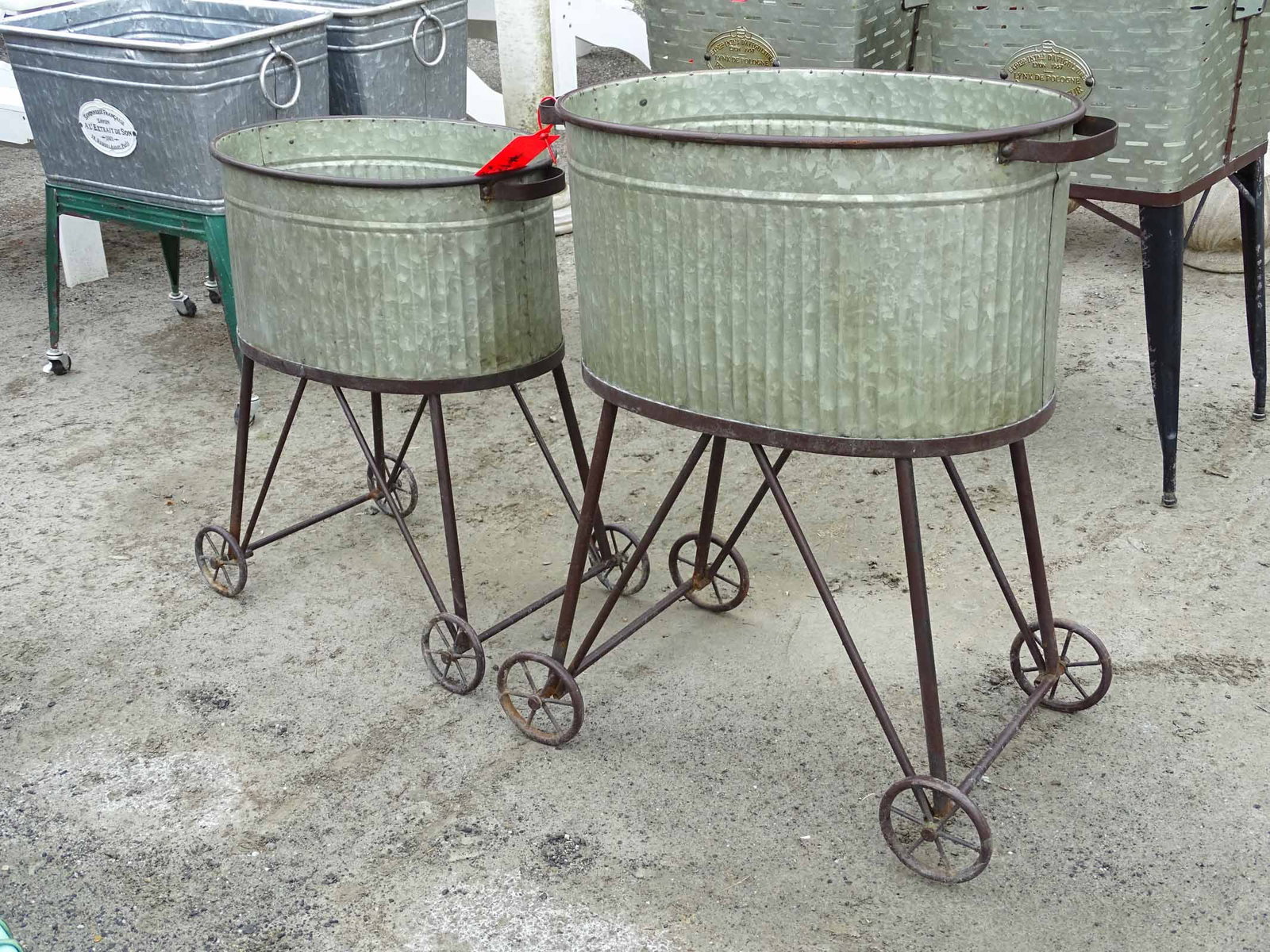 Pair of Planters: Pair of French style rolling planters. 21" W., 23" W..