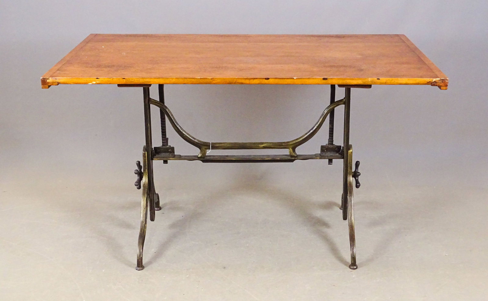 Cast Iron Base Drafting Table: C. 1900's cast iron base drafting table. 60" x 36" x 36 1/2" Ht..