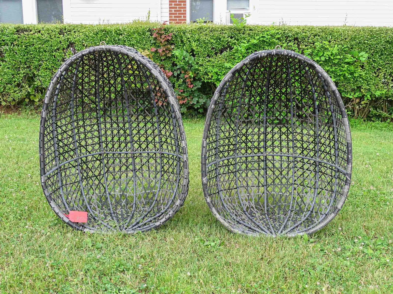 Pair Wicker Style Hanging Chairs: Pair of resin wicker style hanging chairs. 41" Ht..