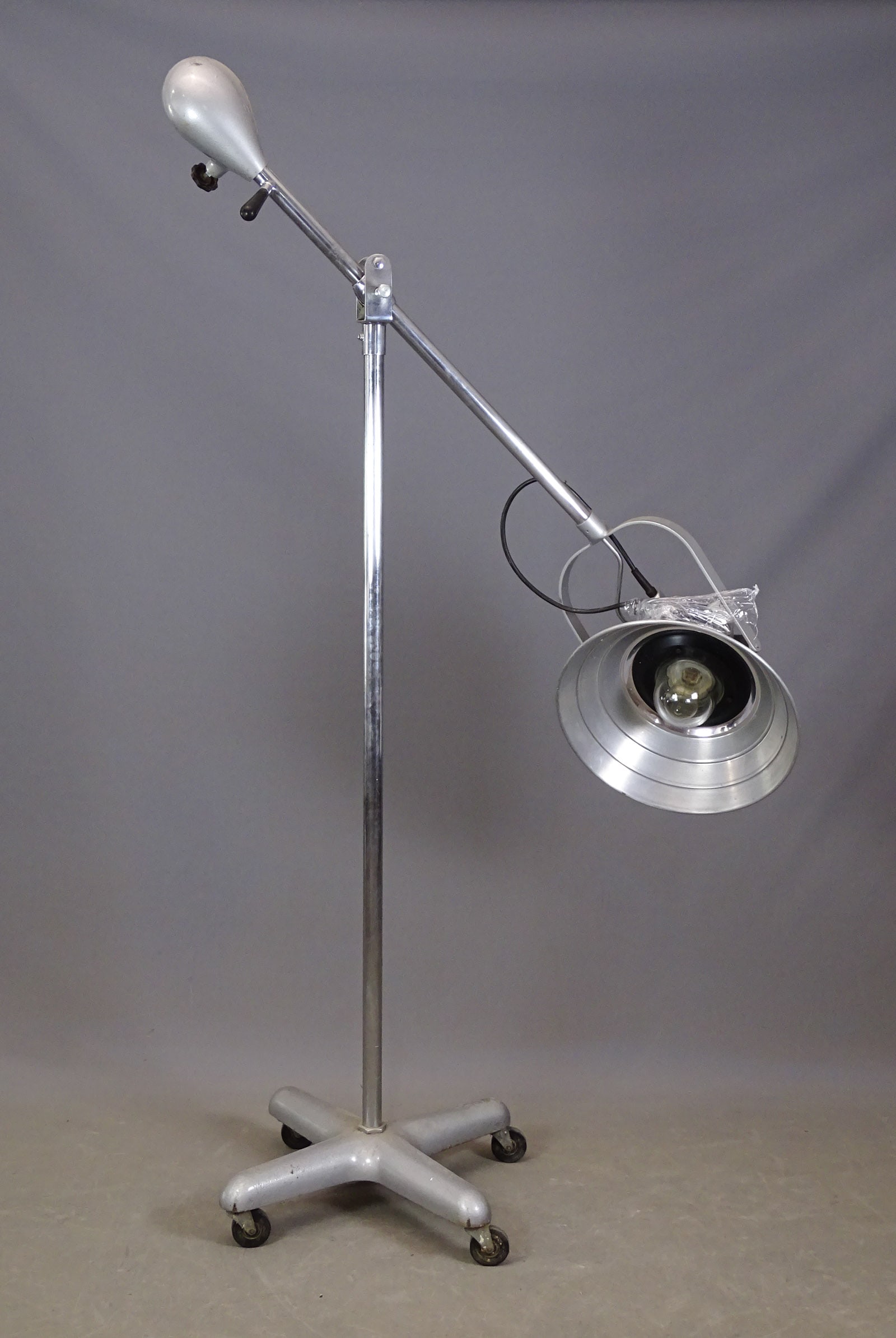 Large Industrial Light: Large rolling Industrial light. Over 7' L.. Adjustable.