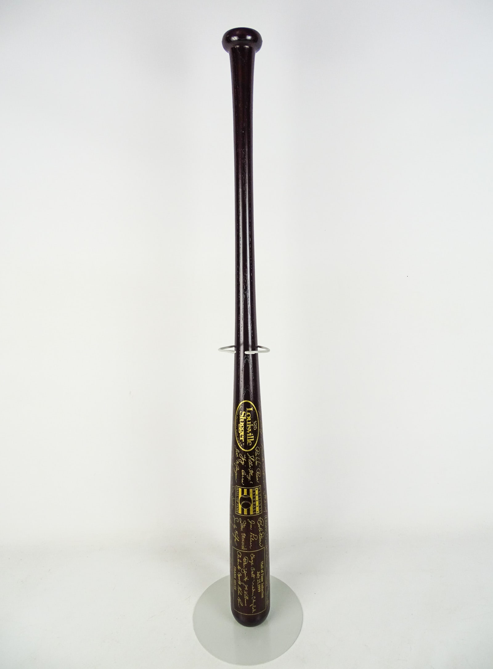 Autographed Baseball Bat: 1999 Hall of Fame autographed baseball bat including: George Brett, Orlando Cepeda, Nesto Chylak, Nolan Ryan, Joe Williams, Robin Yount..".