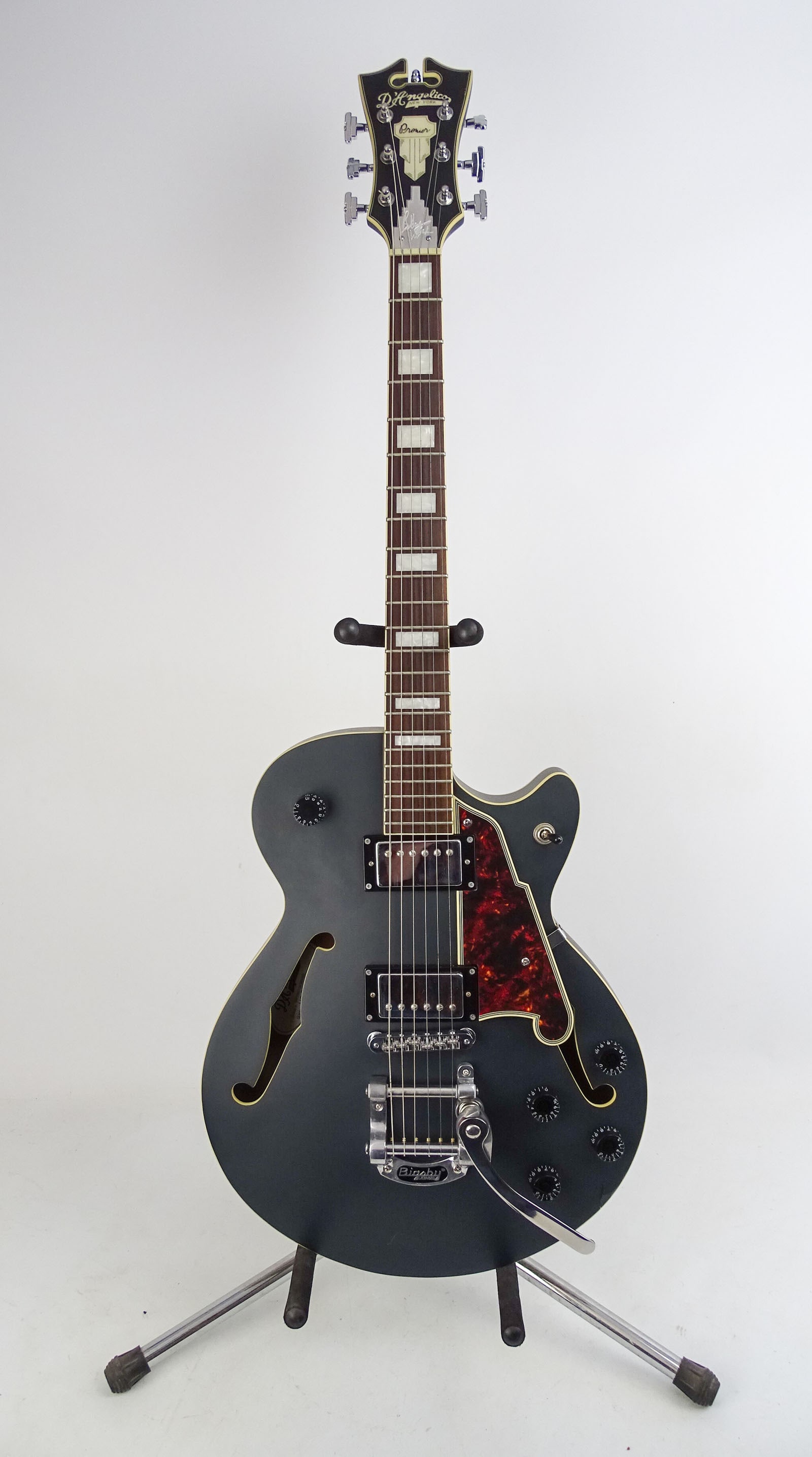 D 'Angelico Guitar: D 'Angelico Bob Weir model electric guitar. SN#US7007. As found, was dropped and jack is stuffed in and area is cracked. Parts or for repair. Comes with original bag.