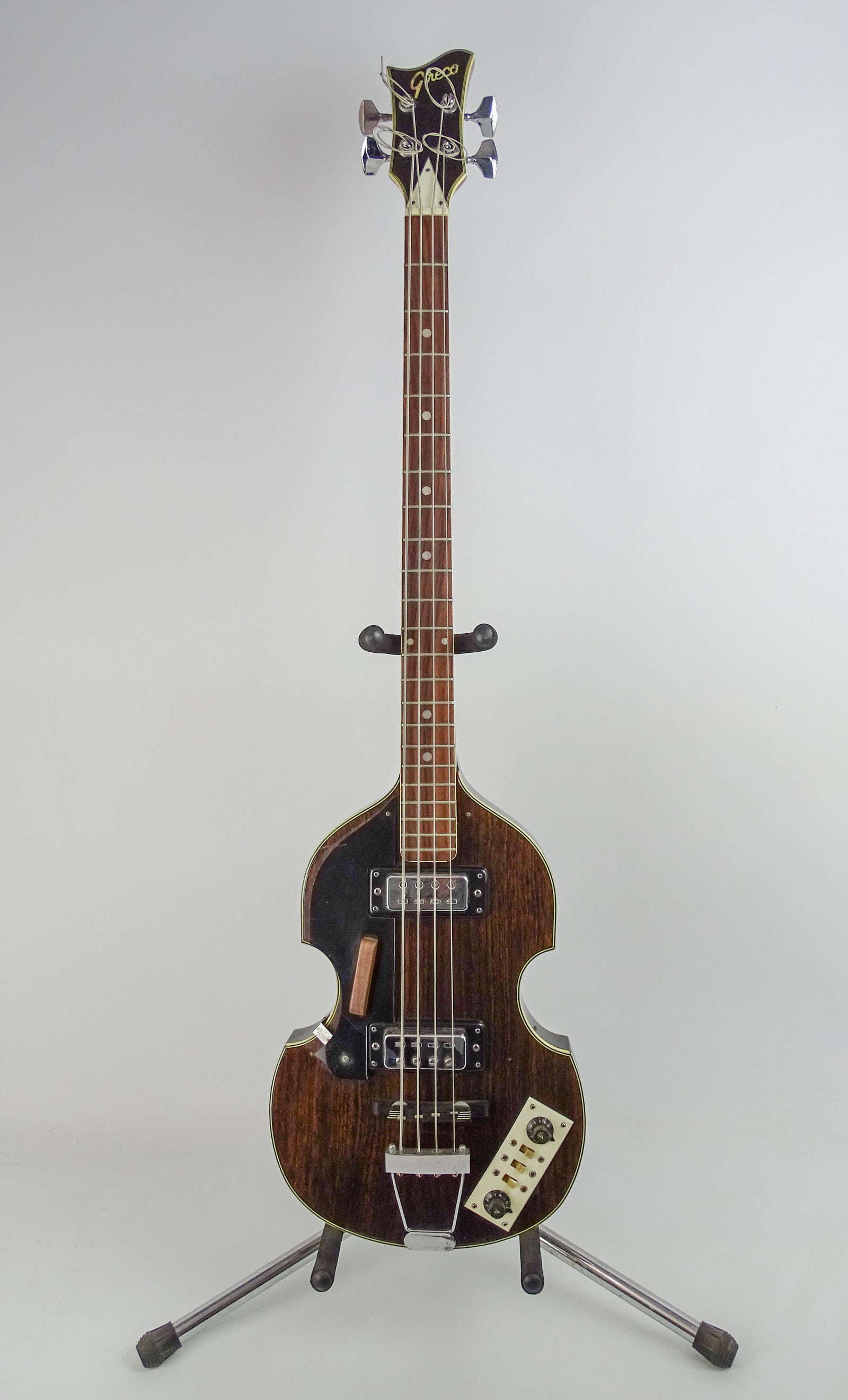 Greco Hofner Style Bass Guitar: Grego V*-50 Hofner style Beatles bass. C. 1970's, made in Japan. Violin shaped hollow body with deluxe hard shell case. 42" L..