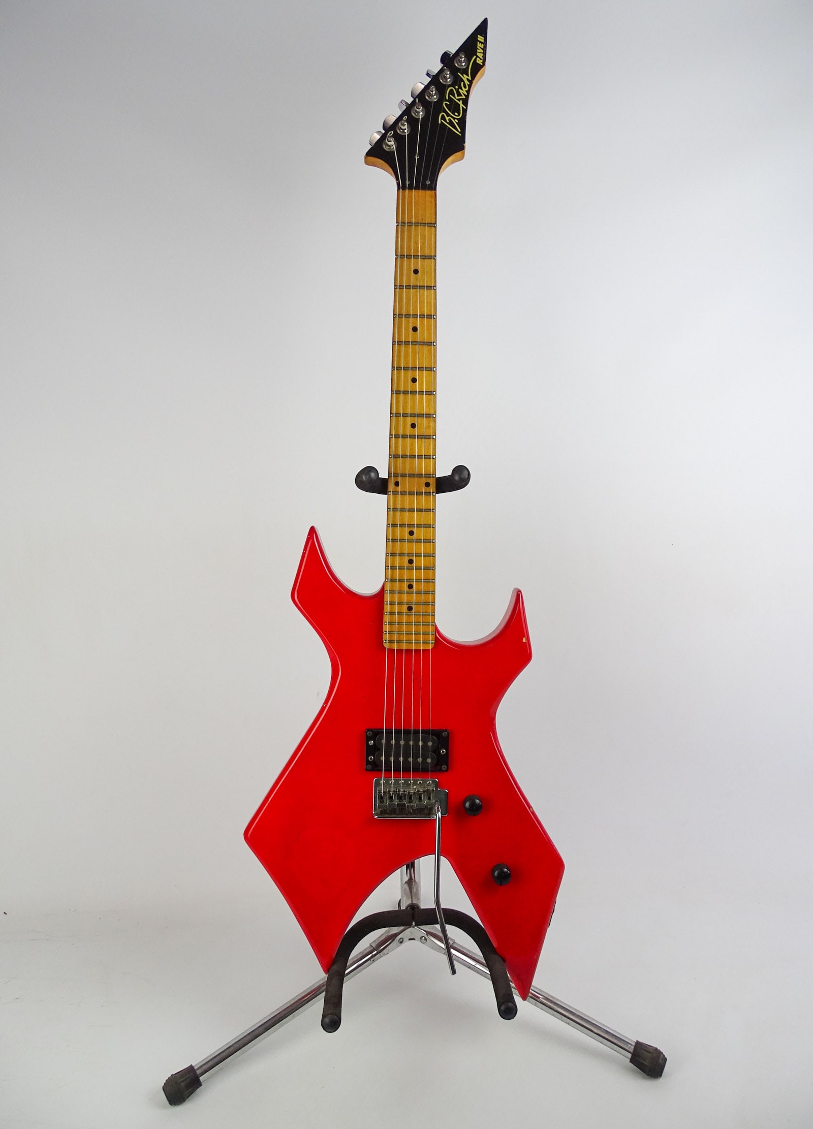 B.C. Rich Rave II Warlock Guitar: B.C. Rich Rave II electric guitar "Warlock". C. 1980's, 24 frets, SN#18902. 42" L.. With gig bag.