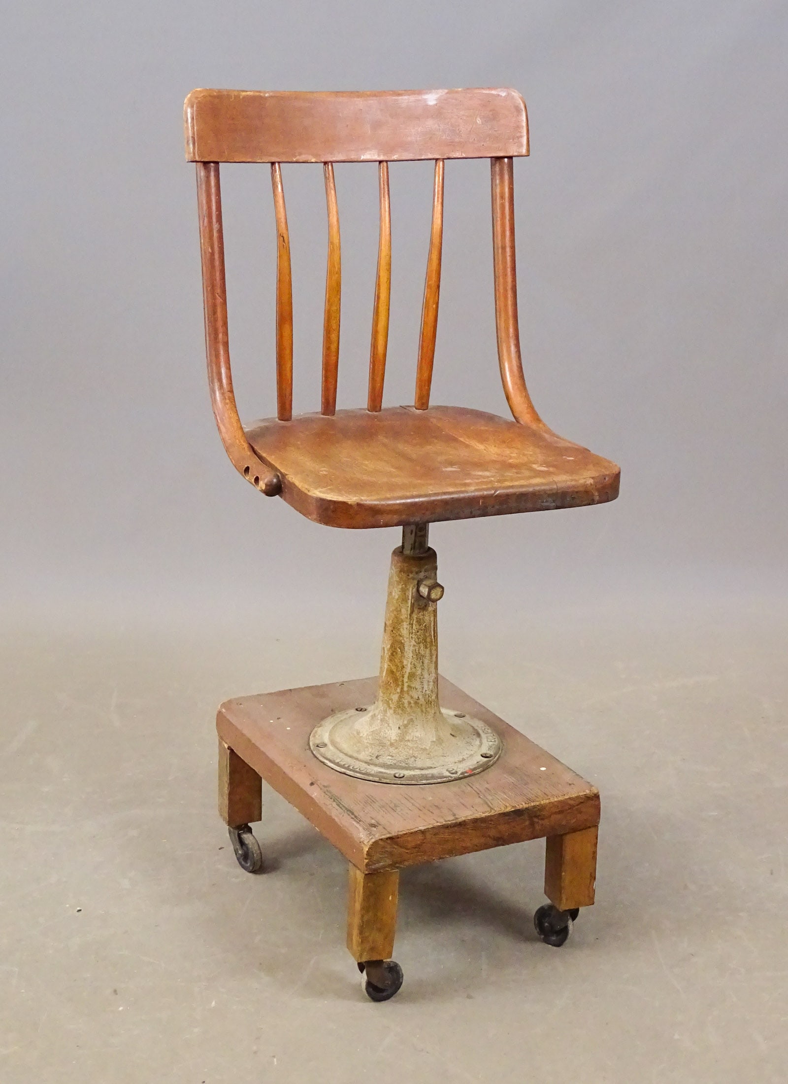 Industrial Stool: Industrial swivel stool. Base marked "HEYWOOD ECLIPSE". 22" seat Ht., 37" overall Ht..