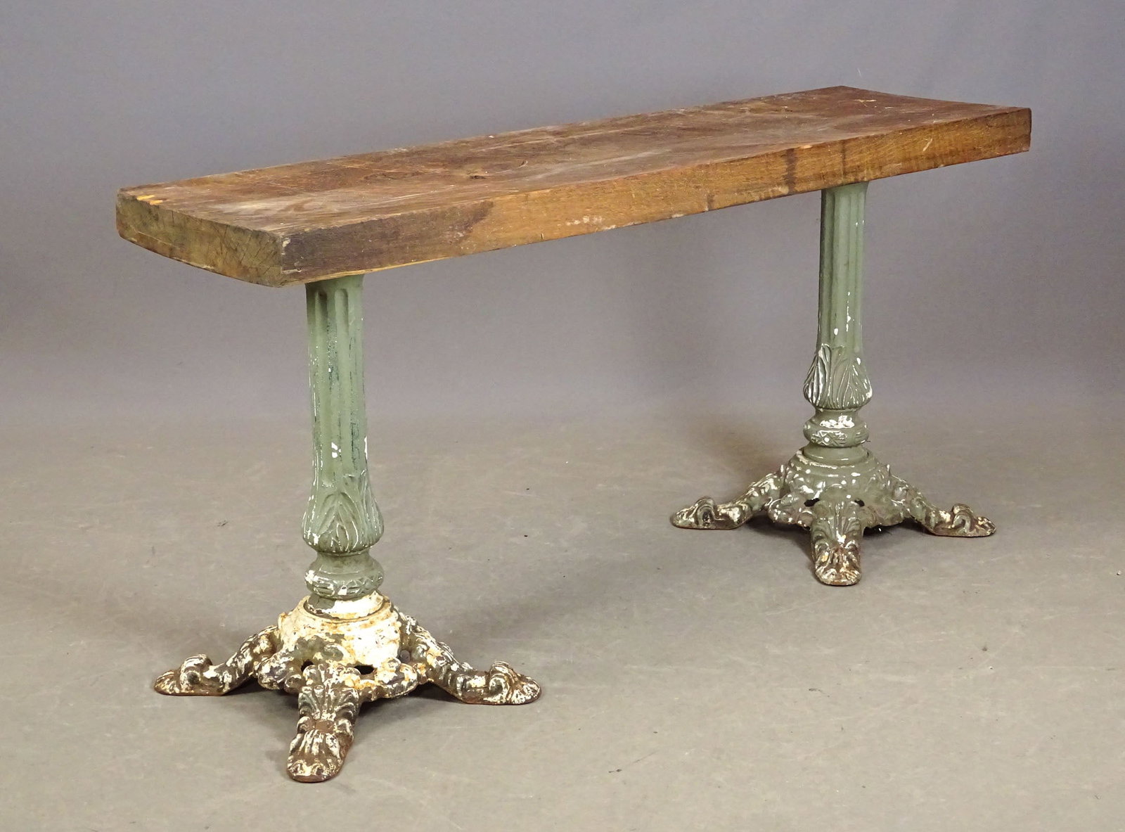 Cast Iron Base Table: Thick wooden top table with twin cast iron bases. 60" x 17 1/2" x 30 1/2" Ht..