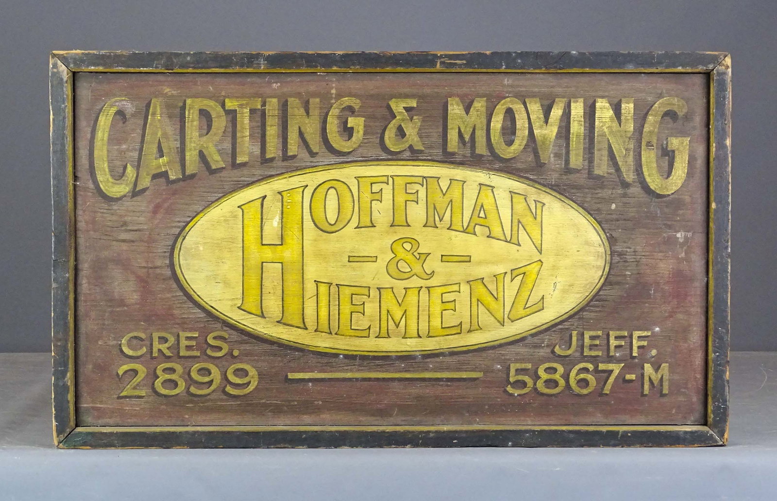 Trade Sign: Painted wooden two sided trade sign "CARTING & MOVING HOFFMAN & HIEMENZ…". 15" x 25 1/2".